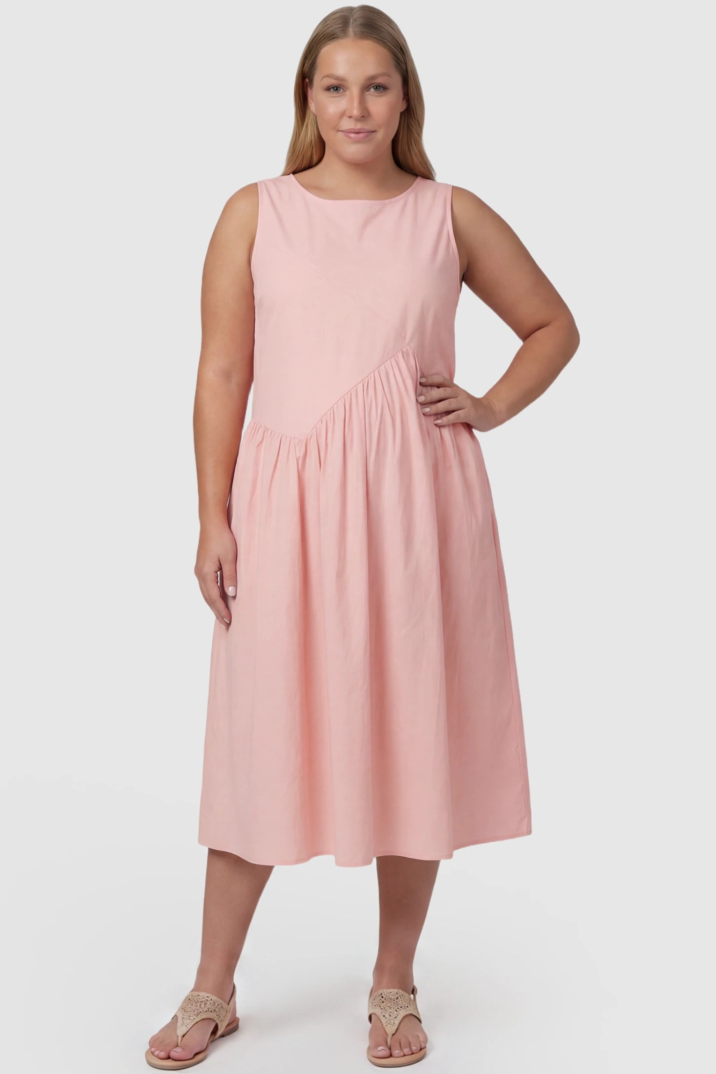 Sleeveless A-Line Maternity Midi Dress with Pockets Sleeveless A-line maternity midi dress with pockets in pink with sleeveless design and soft drape, front view on plus-size model