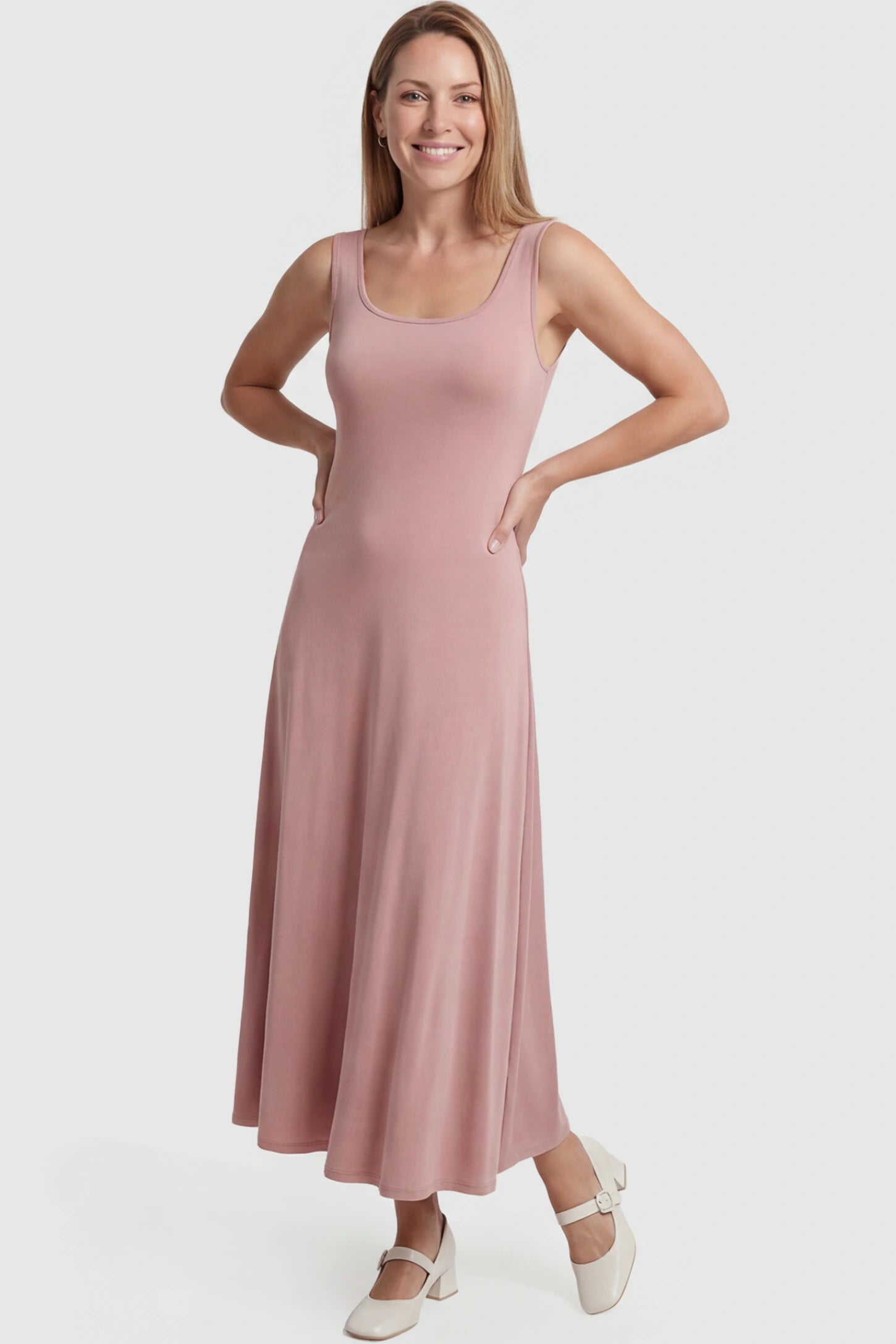 Square Neck Sleeveless Maternity Maxi Dress Square neck sleeveless maternity maxi dress in pink with sleeveless design, front view on postpartum model