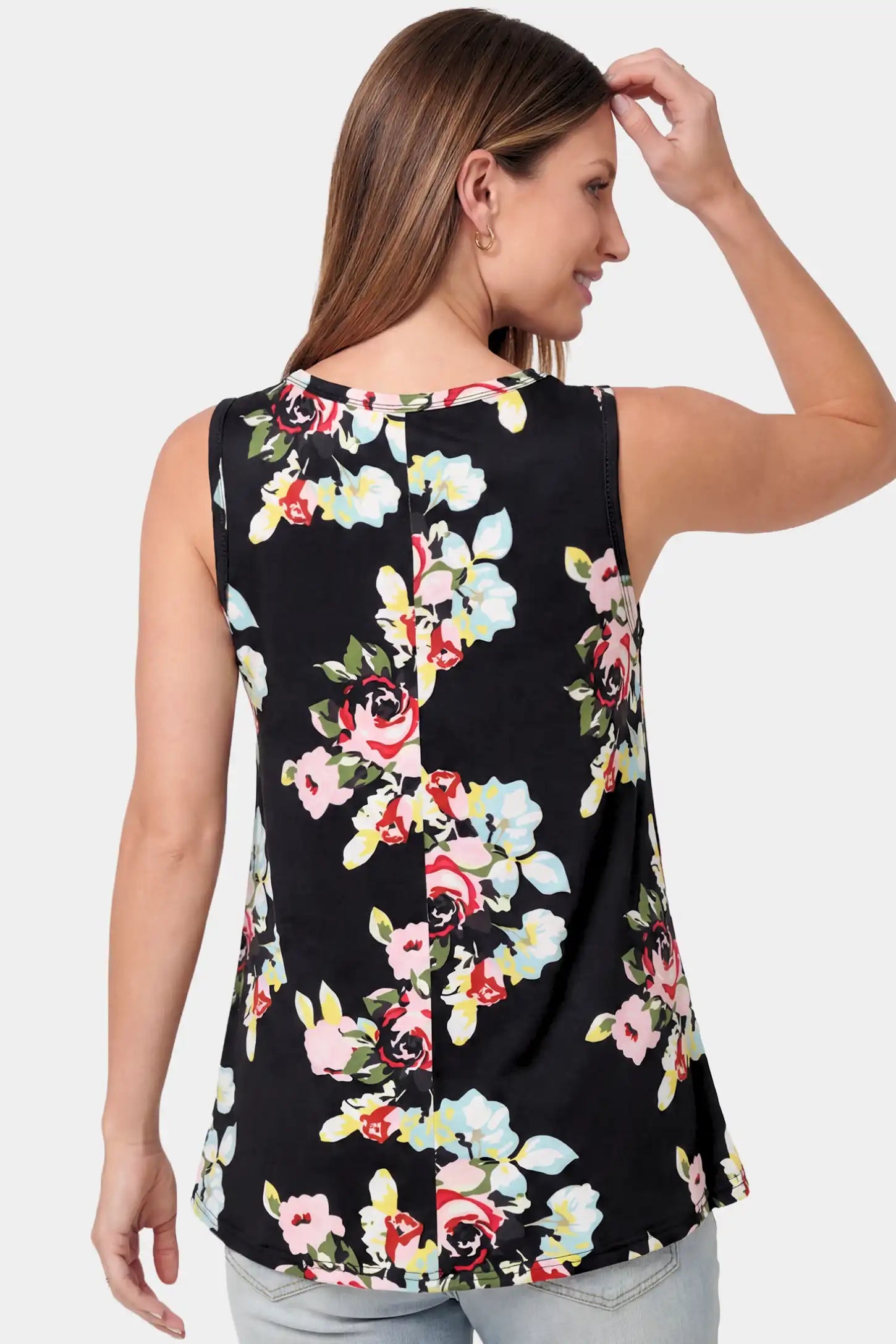 Floral Round Neck Maternity & Nursing Top Floral Round Neck Maternity & Nursing Top in black floral print featuring a sleeveless A-line silhouette on a pregnant model.