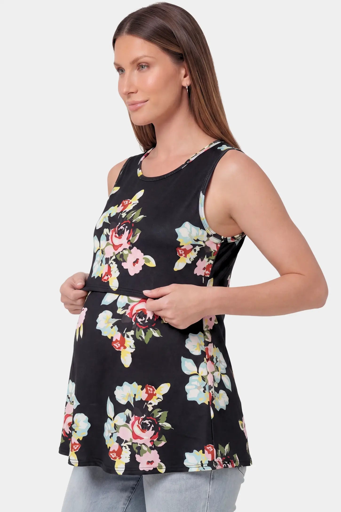 Floral Round Neck Maternity & Nursing Top in black floral print featuring a sleeveless A-line silhouette on a pregnant model.
