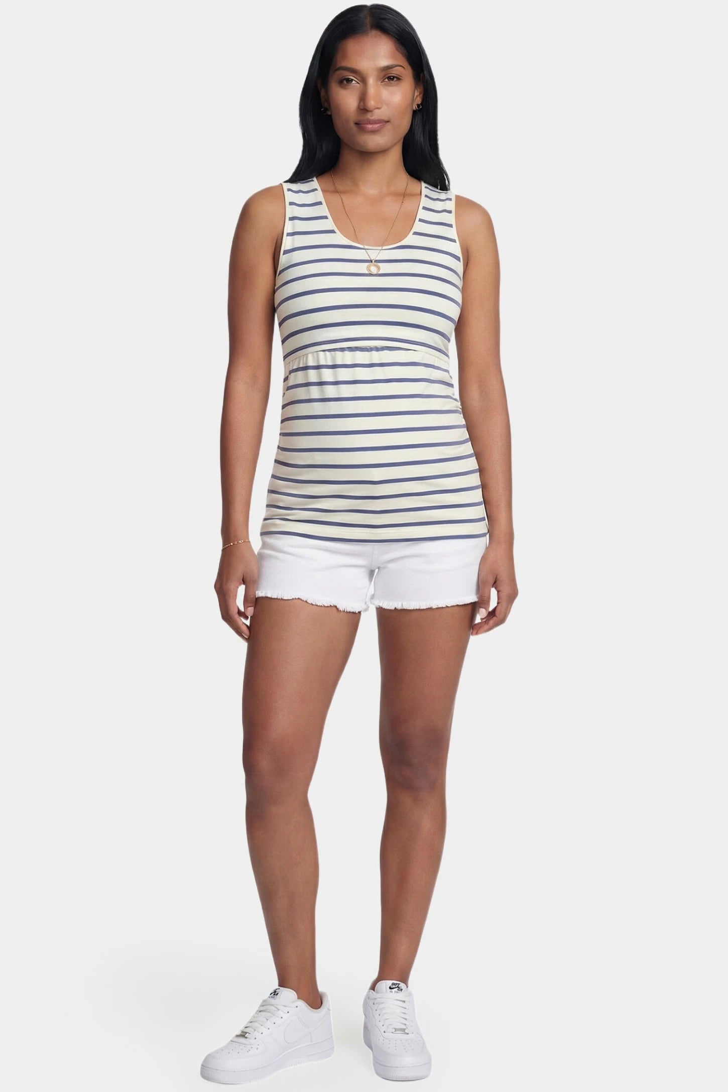 Concealed Nursing Opening Sleeveless Maternity & Nursing Top Concealed Nursing Opening Sleeveless Maternity & Nursing Top in Blue and White Stripes featuring a sleeveless cut shown in full body view on a postpartum model.