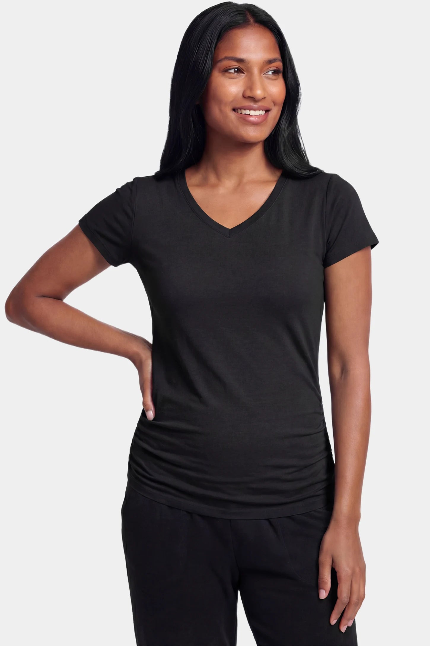 Slim Fit V-Neck Short Sleeve Maternity Top Slim fit V-neck short sleeve maternity top in black featuring soft stretch fabric in front view on a postpartum model