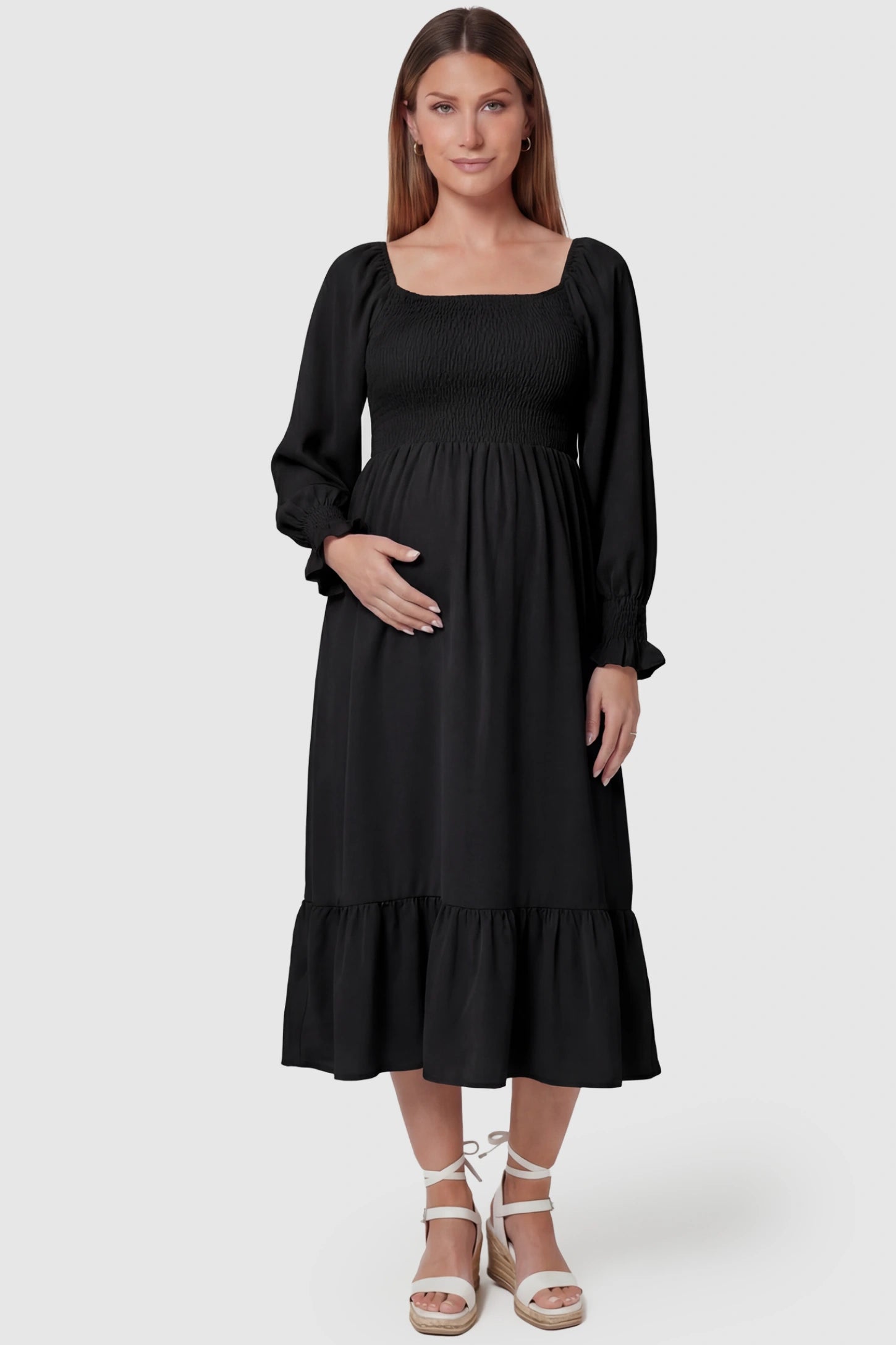 Smocked Square Neck Ruffle Hem Midi Maternity Dress Smocked square neck ruffle hem midi maternity dress in black featuring chic square neckline in front view on a pregnant model