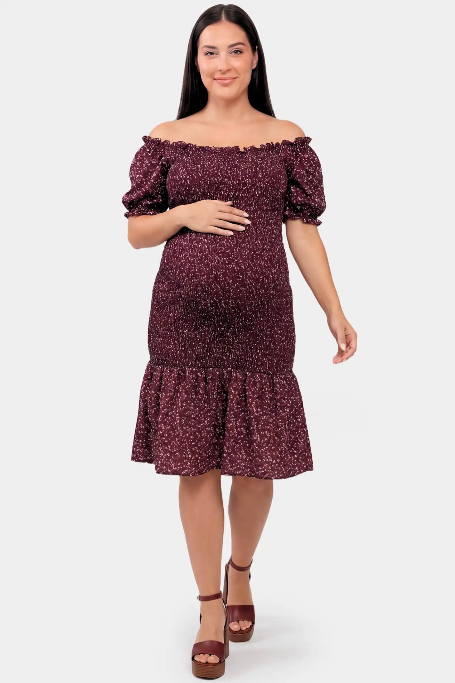 Short Puff Sleeve Smocked Maternity Midi Dress Short Puff Sleeve Smocked Maternity Midi Dress in burgundy floral featuring off shoulder neckline and ruffle hem on a a plus size pregnant model.