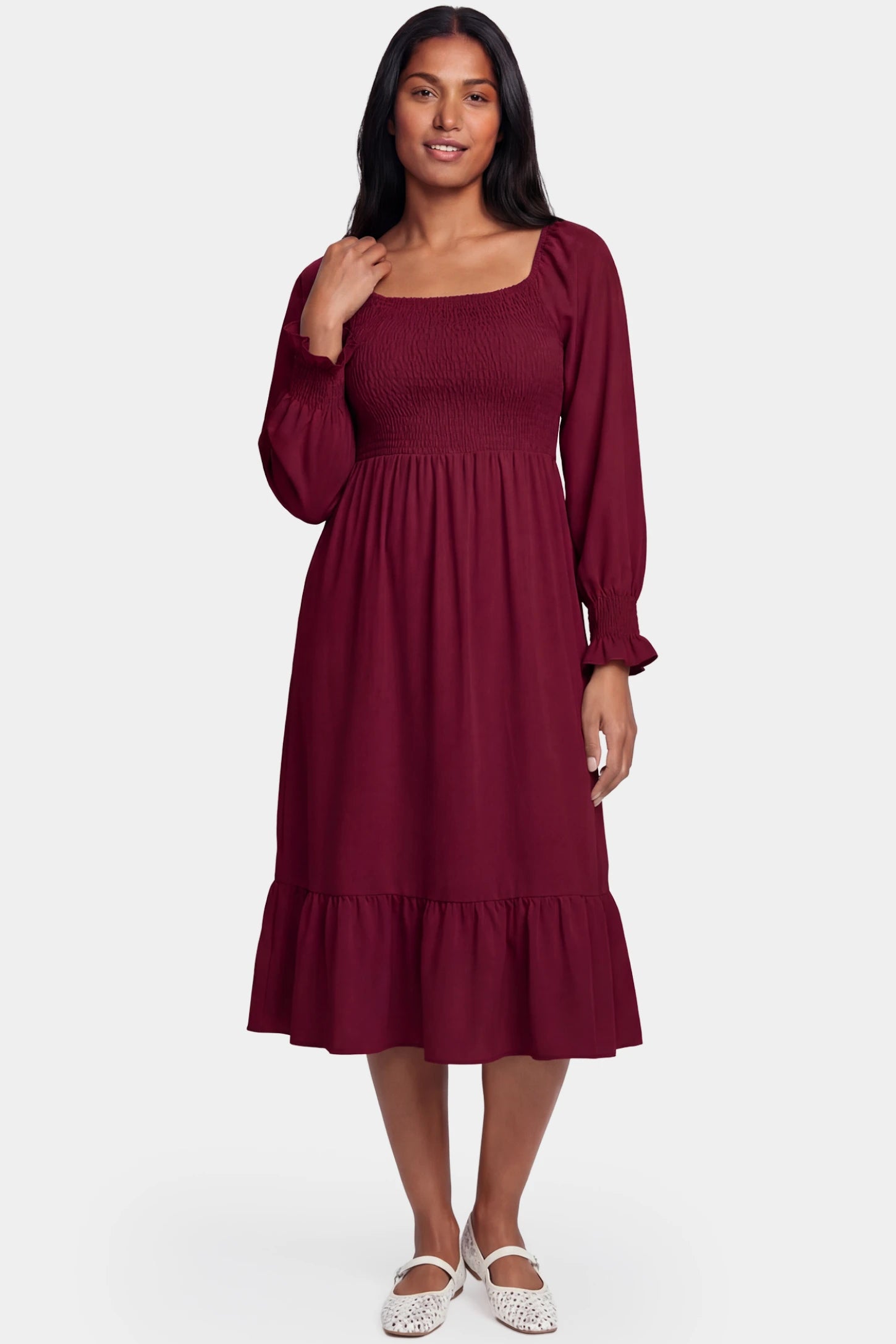 Smocked Square Neck Ruffle Hem Midi Maternity Dress Smocked square neck ruffle hem midi maternity dress in burgundy featuring long sleeves and square neck in front view on a postpartum model