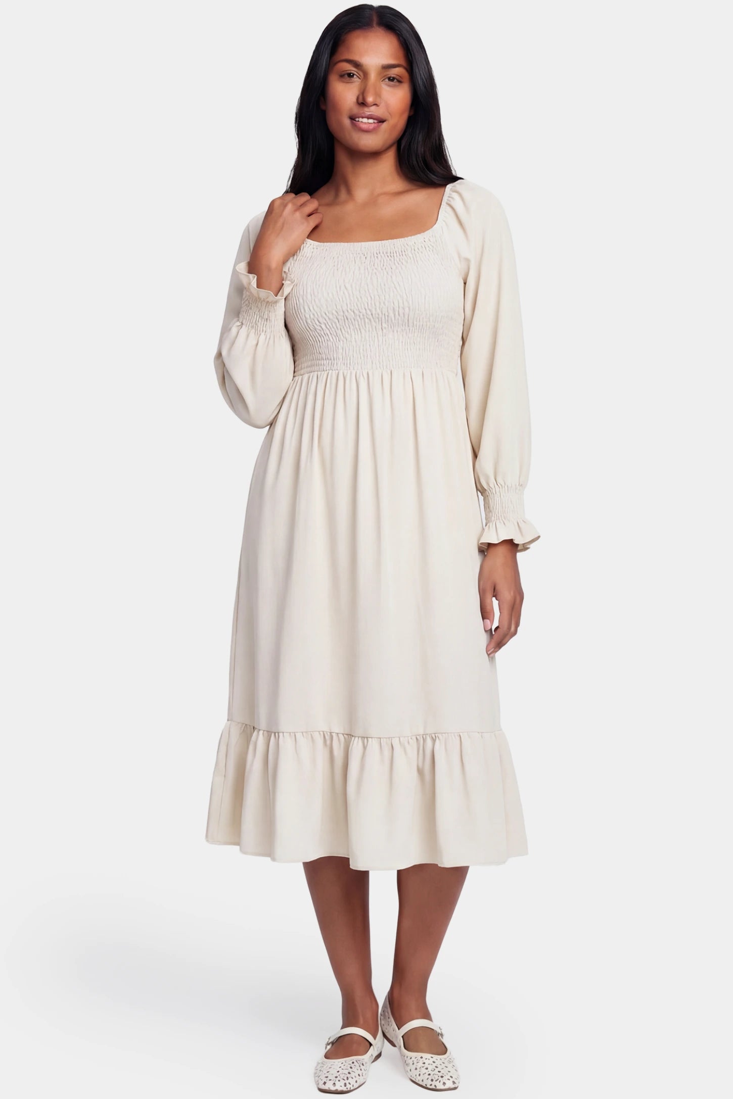 Smocked Square Neck Ruffle Hem Midi Maternity Dress Smocked square neck ruffle hem midi maternity dress in off-white featuring long sleeves and square neck in front view on a postpartum model