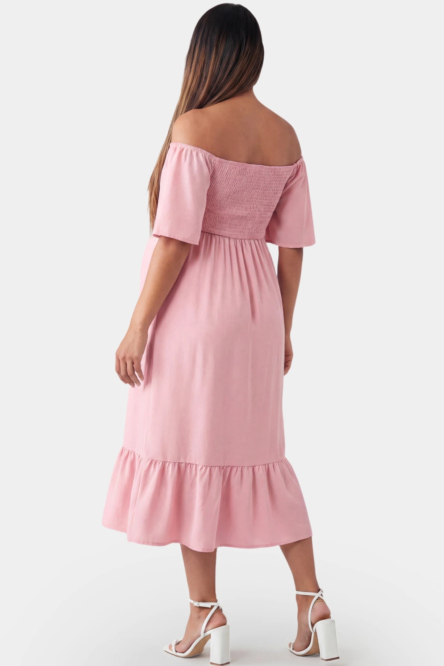 Off-Shoulder Smocked Short Sleeve A-Line Midi Maternity Dress Off-shoulder smocked short sleeve A-line midi maternity dress in pink featuring chiffon drape in back view on a pregnant model