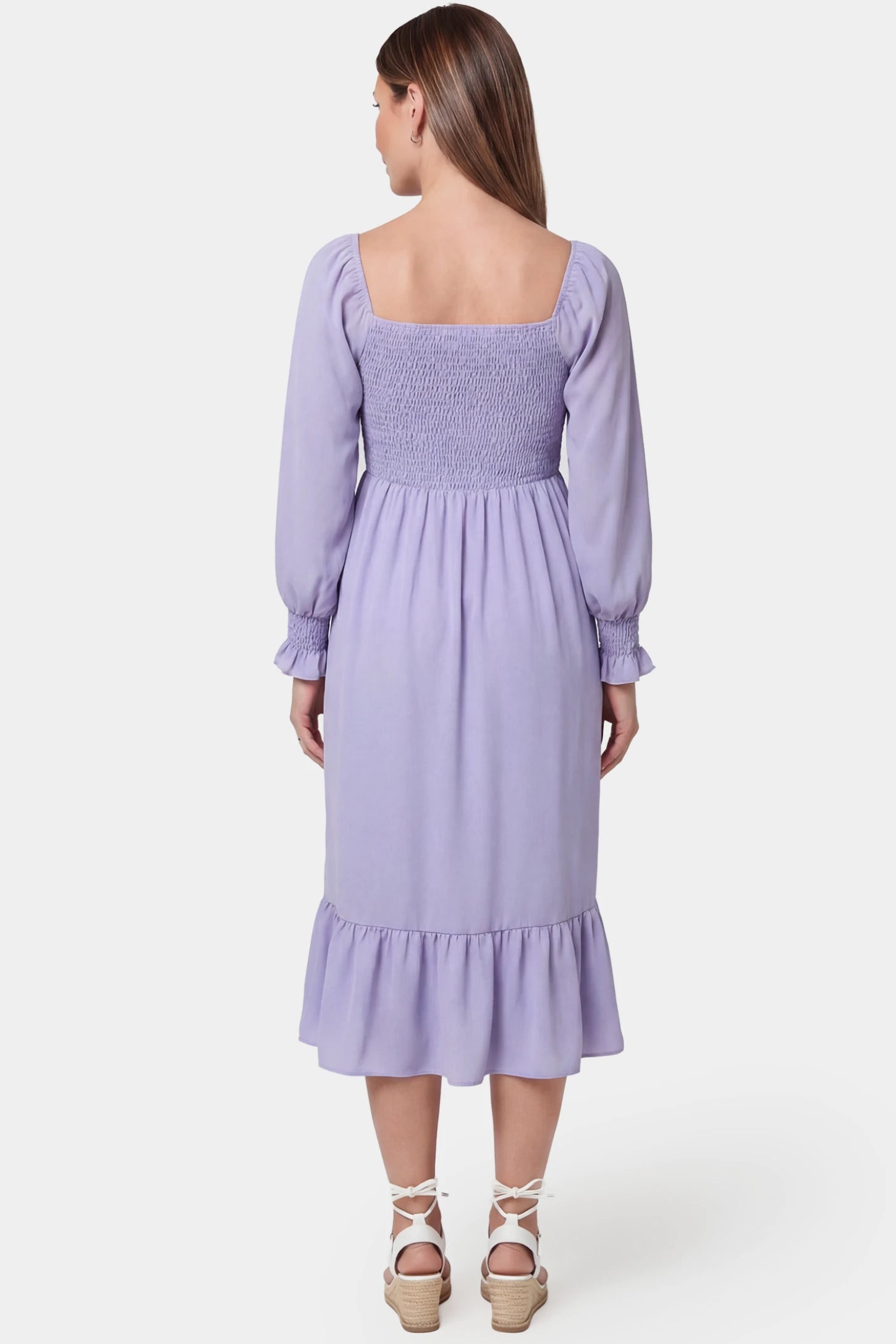 Smocked Square Neck Ruffle Hem Midi Maternity Dress Smocked square neck ruffle hem midi maternity dress in purple featuring long sleeves and ruffle hem in back view on a pregnant model