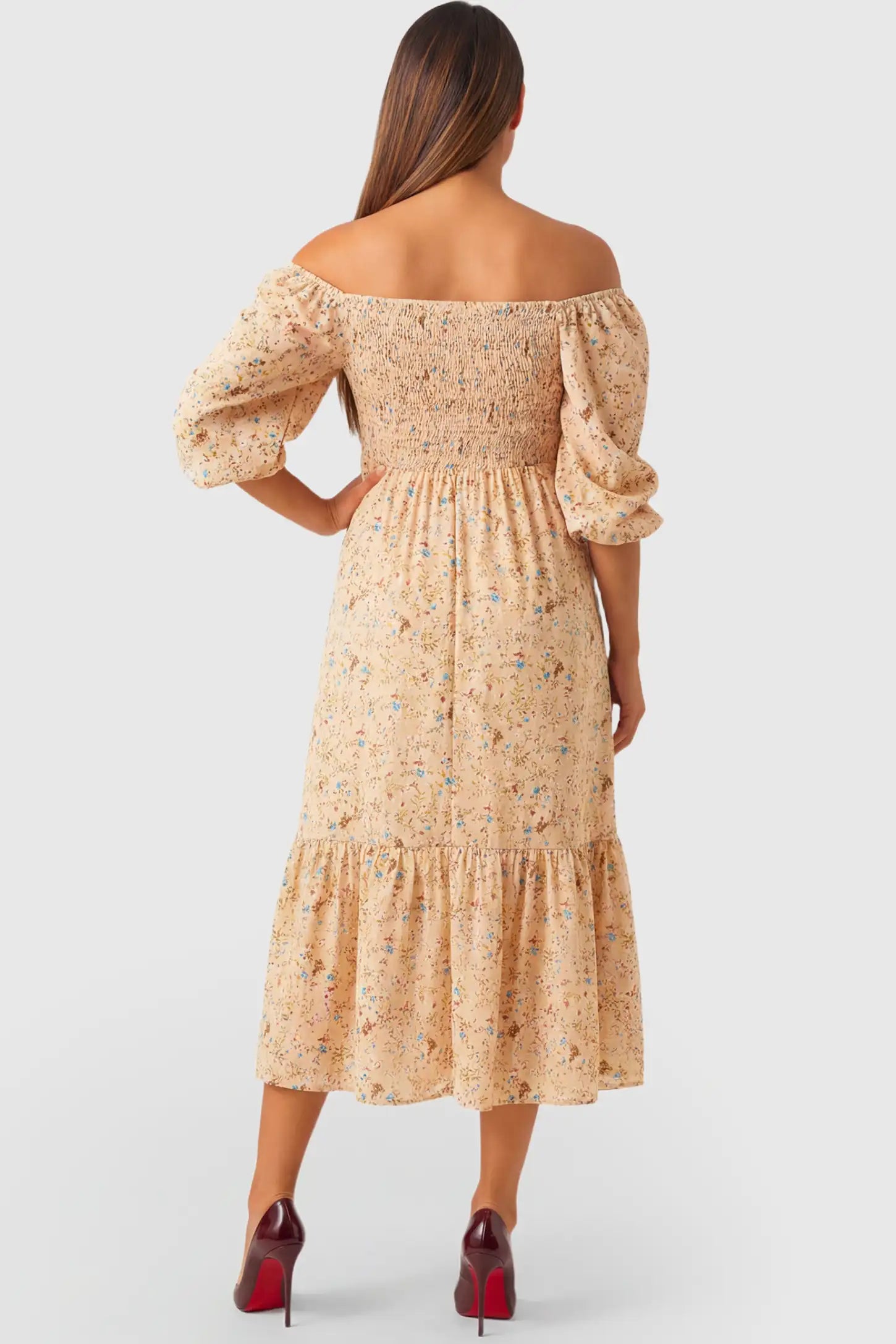 Floral Off Shoulder Tiered Maternity Midi Dress Floral Off Shoulder Tiered Maternity Midi Dress in yellow featuring smocked bodice and long puff sleeves on a pregnant model.