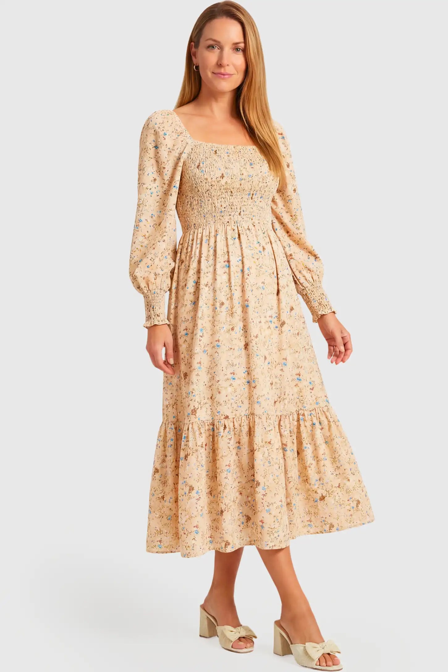 Floral Off Shoulder Tiered Maternity Midi Dress Floral Off Shoulder Tiered Maternity Midi Dress in yellow featuring smocked bodice and long puff sleeves on a non pregnant model.