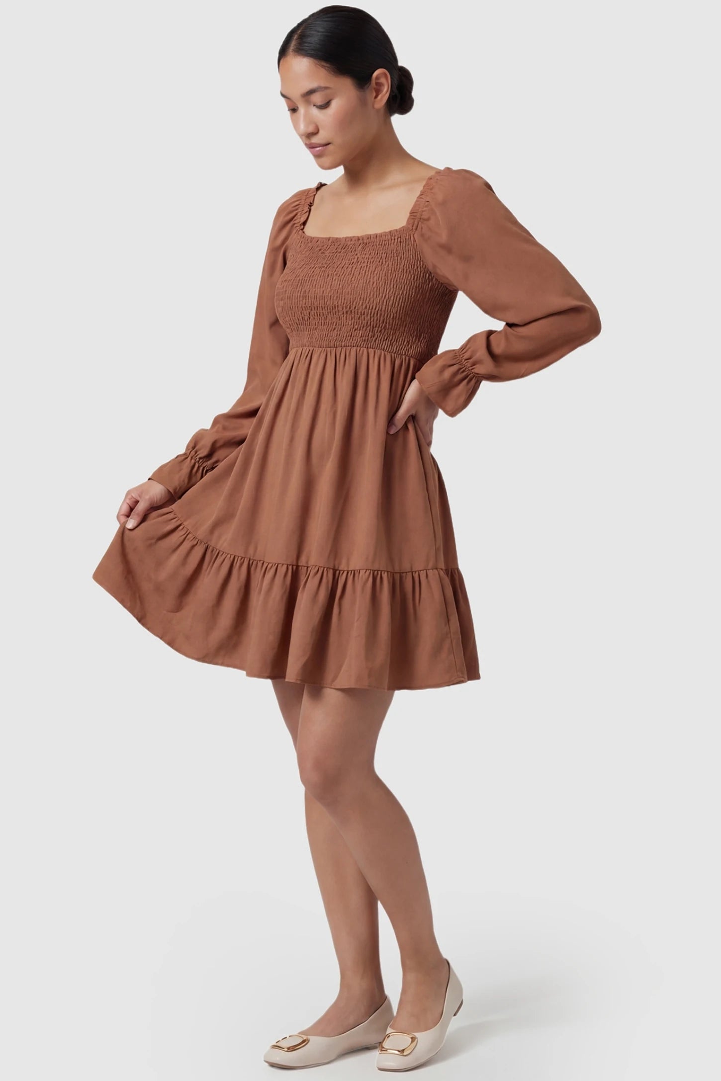 Smocked Chiffon A-Line Maternity Mini Dress Camel Smocked Chiffon A-Line Maternity Mini Dress featuring a smocked bodice on a non-pregnant model, front view.
