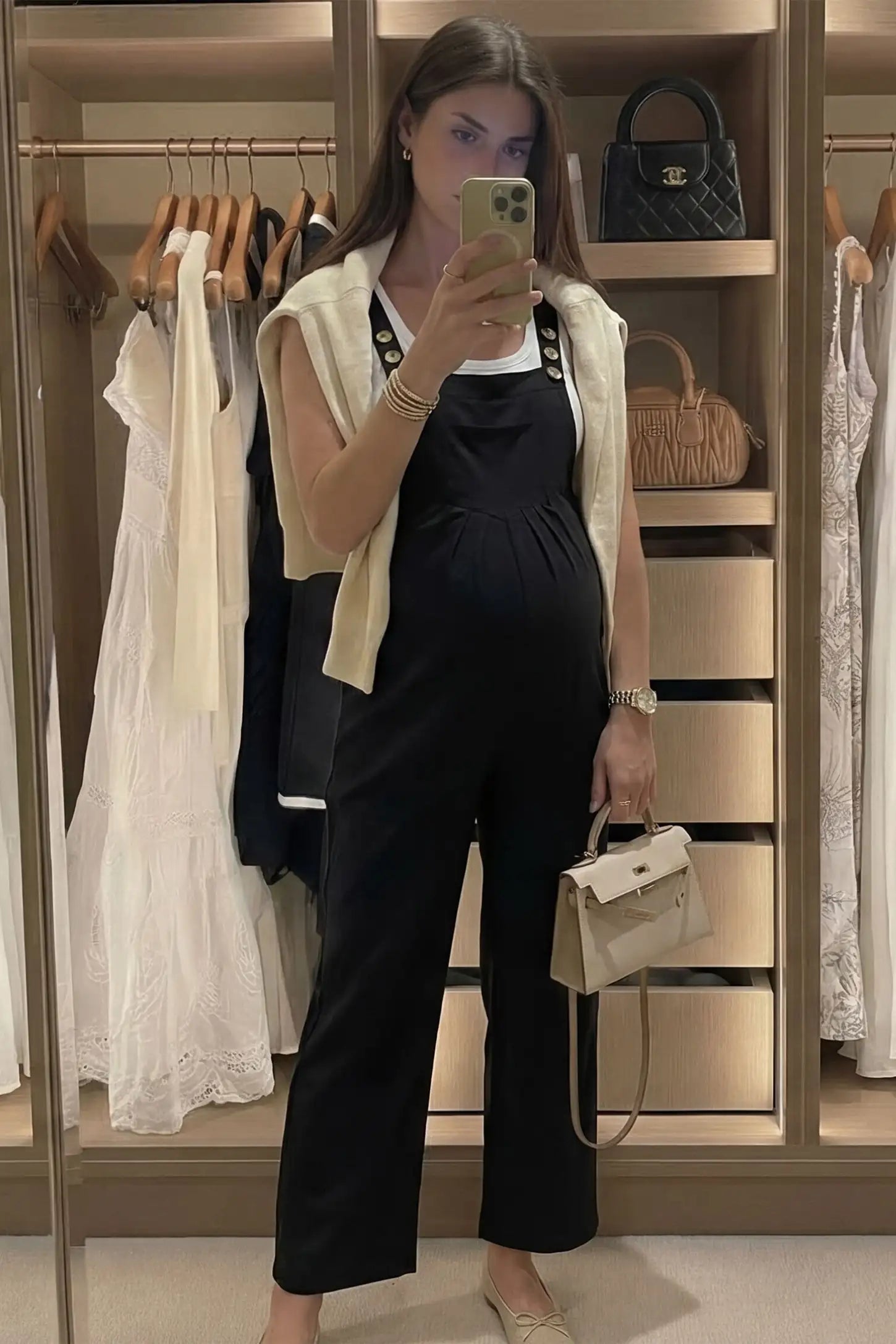 Full-Length Pocketed Maternity Jumpsuit Full-Length Pocketed Maternity Jumpsuit in Black featuring adjustable straps and a relaxed fit on a pregnant model, front view.
