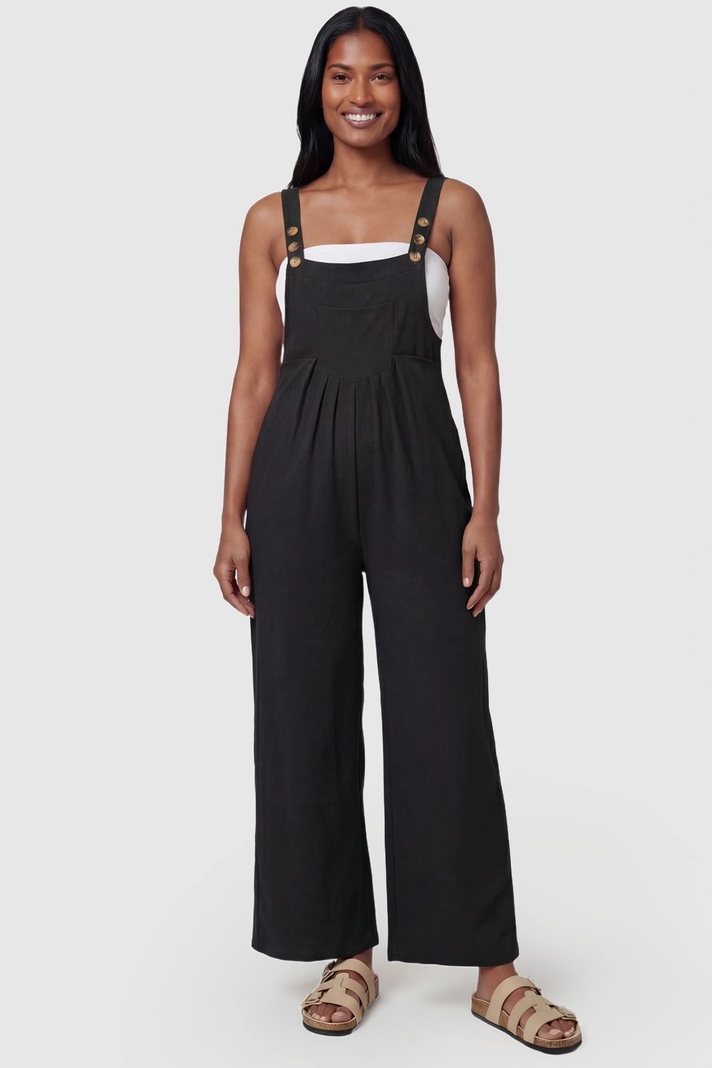 Full-Length Pocketed Maternity Jumpsuit Full-Length Pocketed Maternity Jumpsuit in Black featuring adjustable straps and a relaxed fit on a model, postpartum.