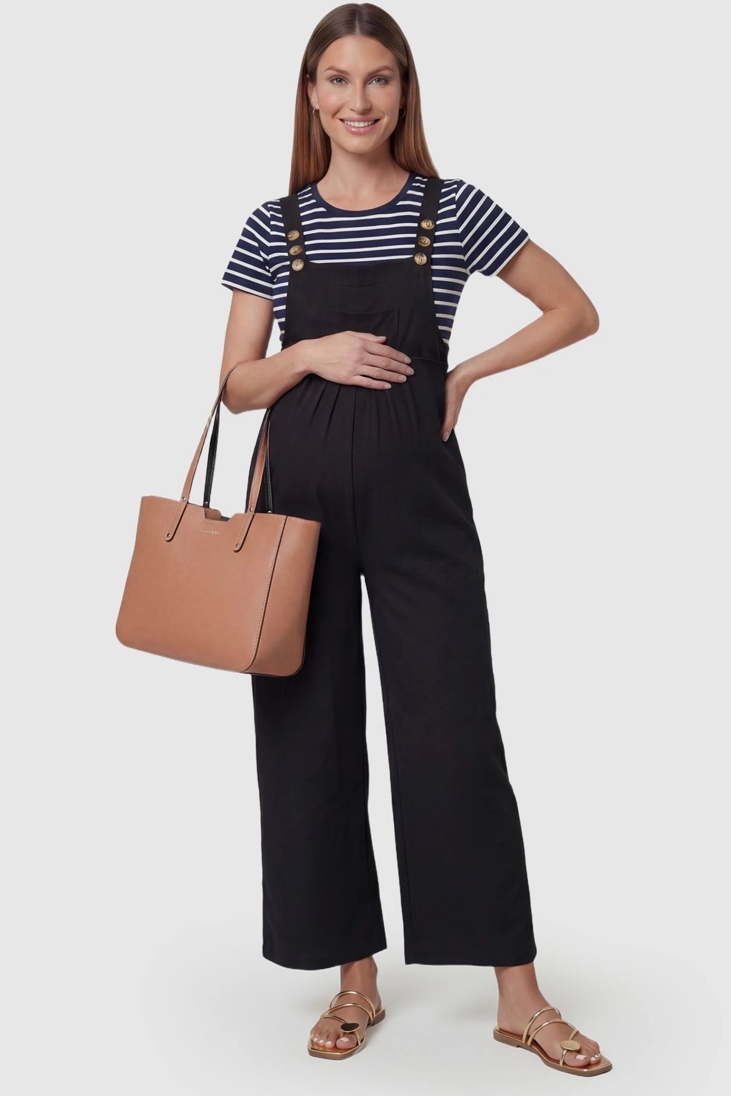 Full-Length Pocketed Maternity Jumpsuit Full-Length Pocketed Maternity Jumpsuit in Black featuring adjustable straps and a relaxed fit on a pregnant model, front view.