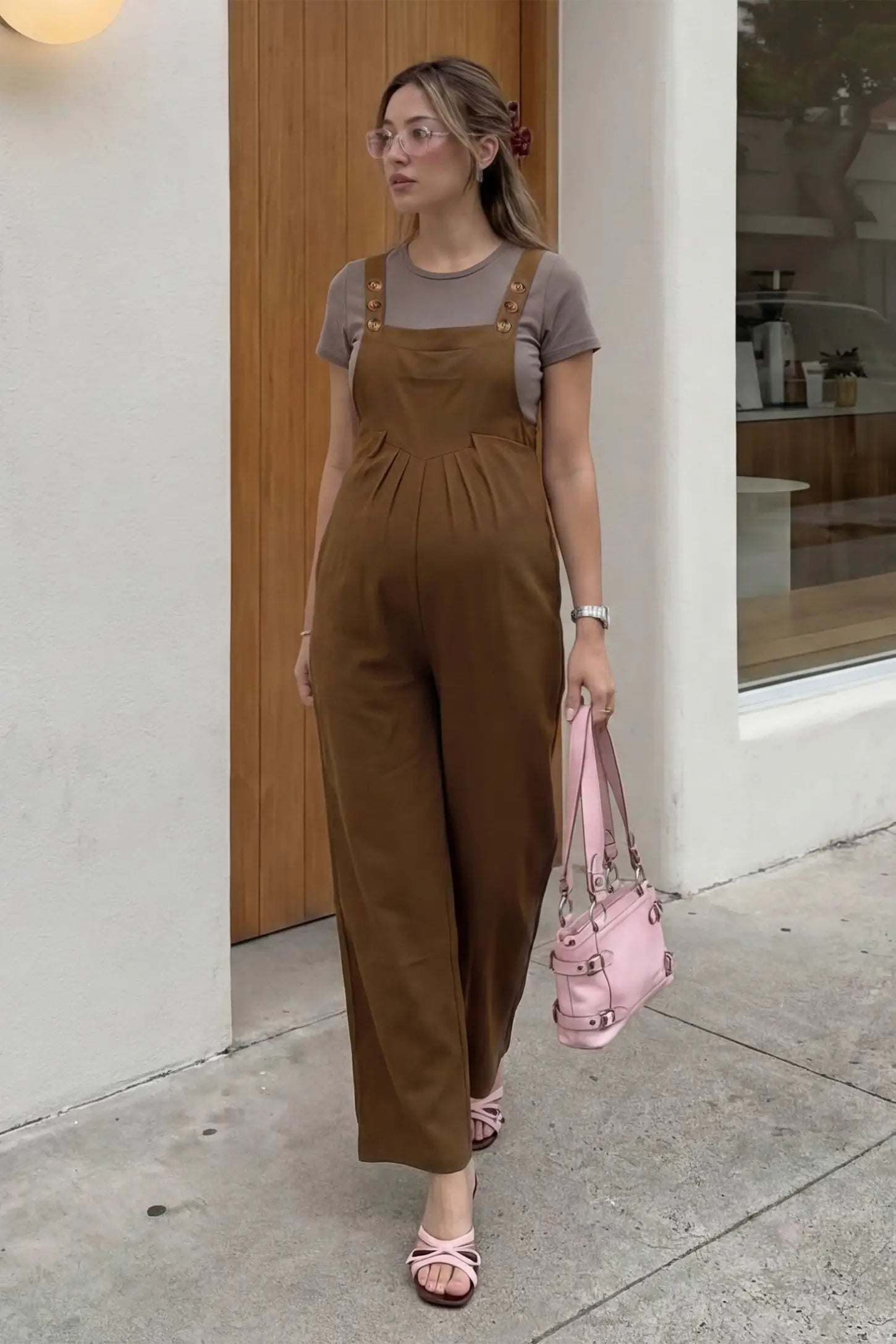 Full-Length Pocketed Maternity Jumpsuit Full-Length Pocketed Maternity Jumpsuit in Camel featuring adjustable straps and a relaxed fit on a pregnant model, front view.
