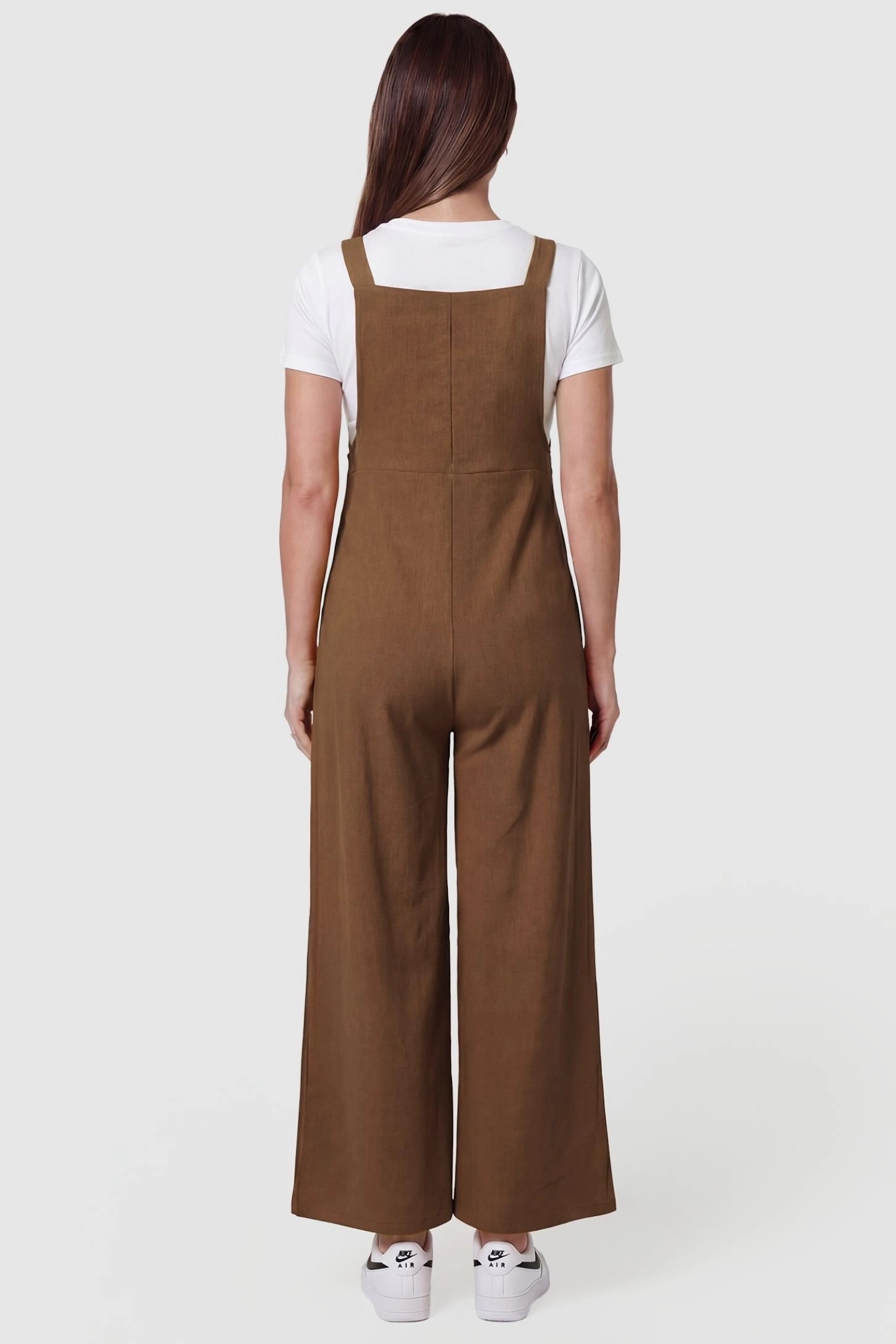 Full-Length Pocketed Maternity Jumpsuit Full-Length Pocketed Maternity Jumpsuit in Camel featuring relaxed fit on a pregnant model, back view.