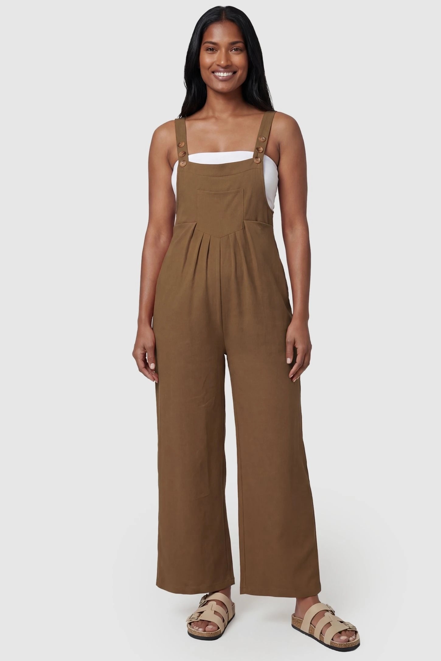 Full-Length Pocketed Maternity Jumpsuit Full-Length Pocketed Maternity Jumpsuit in Camel featuring adjustable straps and a relaxed fit on a model, postpartum.