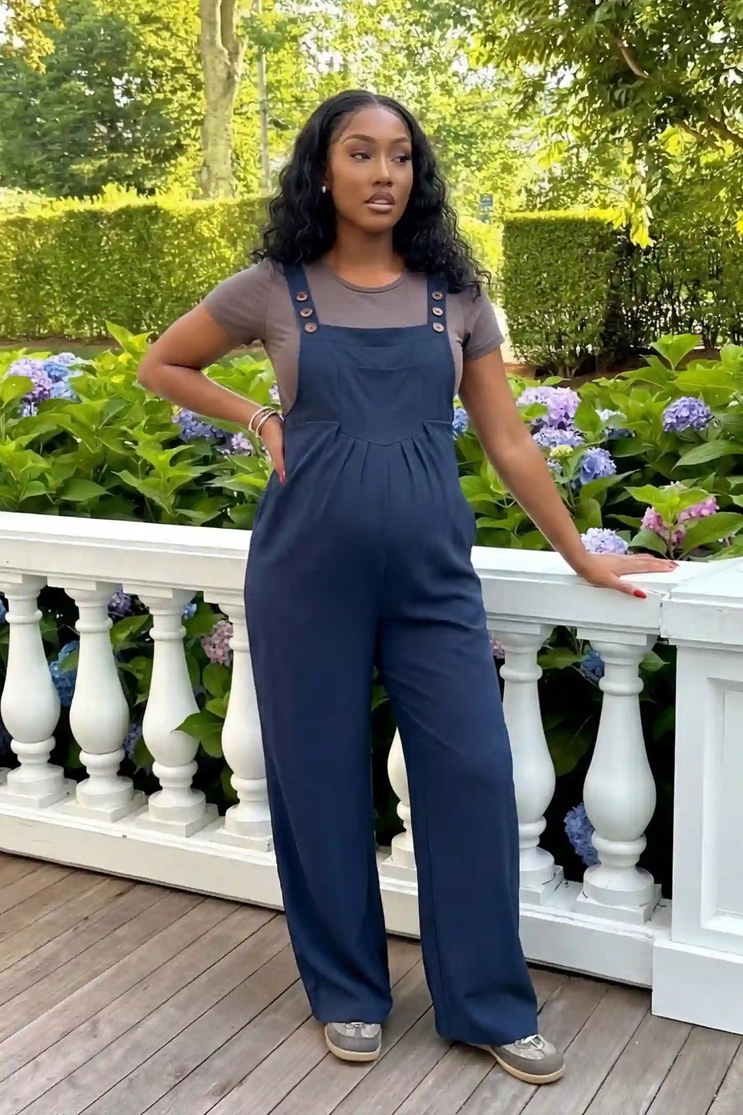 Full-Length Pocketed Maternity Jumpsuit Full-Length Pocketed Maternity Jumpsuit in Dark Blue featuring adjustable straps and a relaxed fit on a pregnant model, front view.