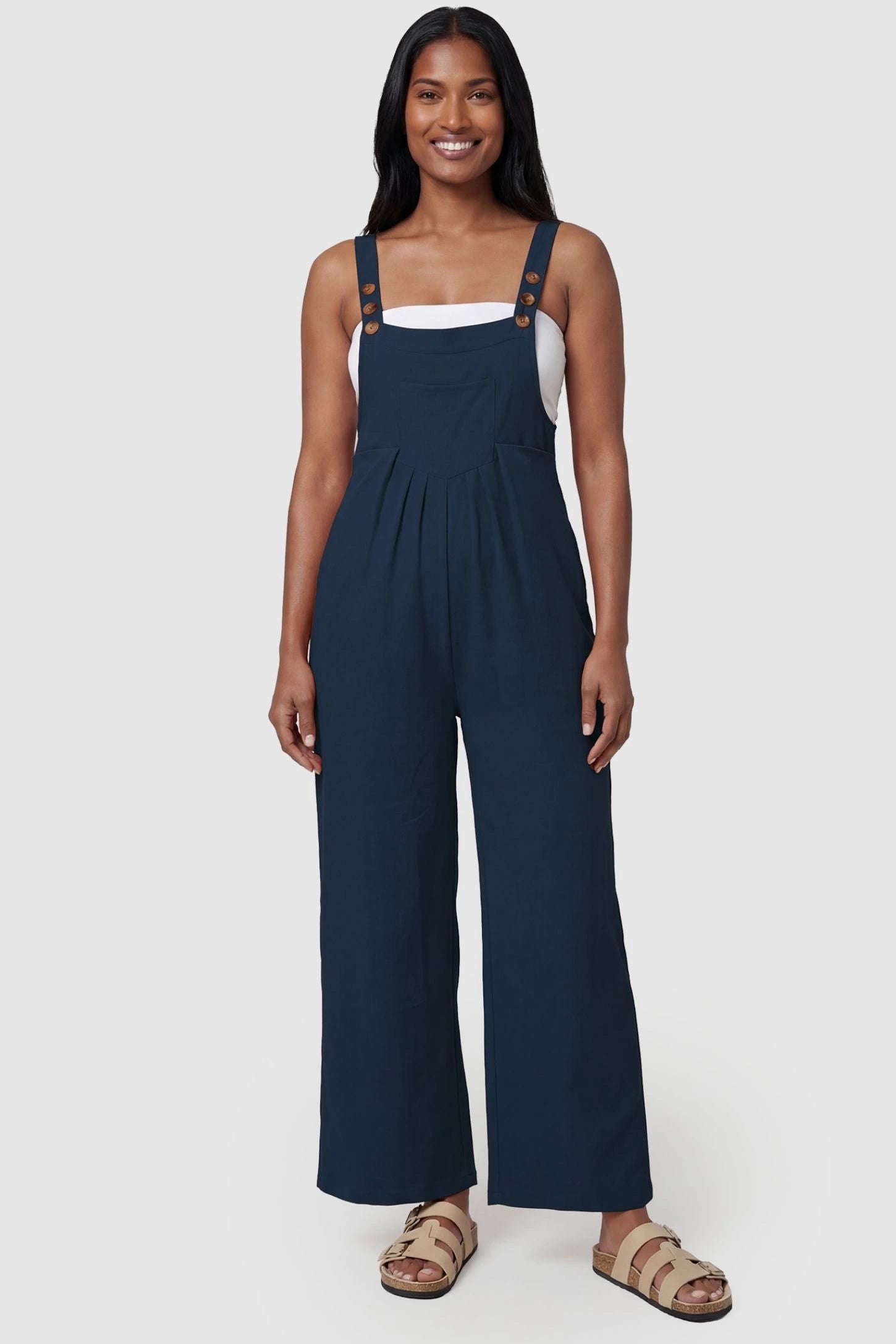 Full-Length Pocketed Maternity Jumpsuit Full-Length Pocketed Maternity Jumpsuit in Dark Blue featuring adjustable straps and a relaxed fit on a model, postpartum.