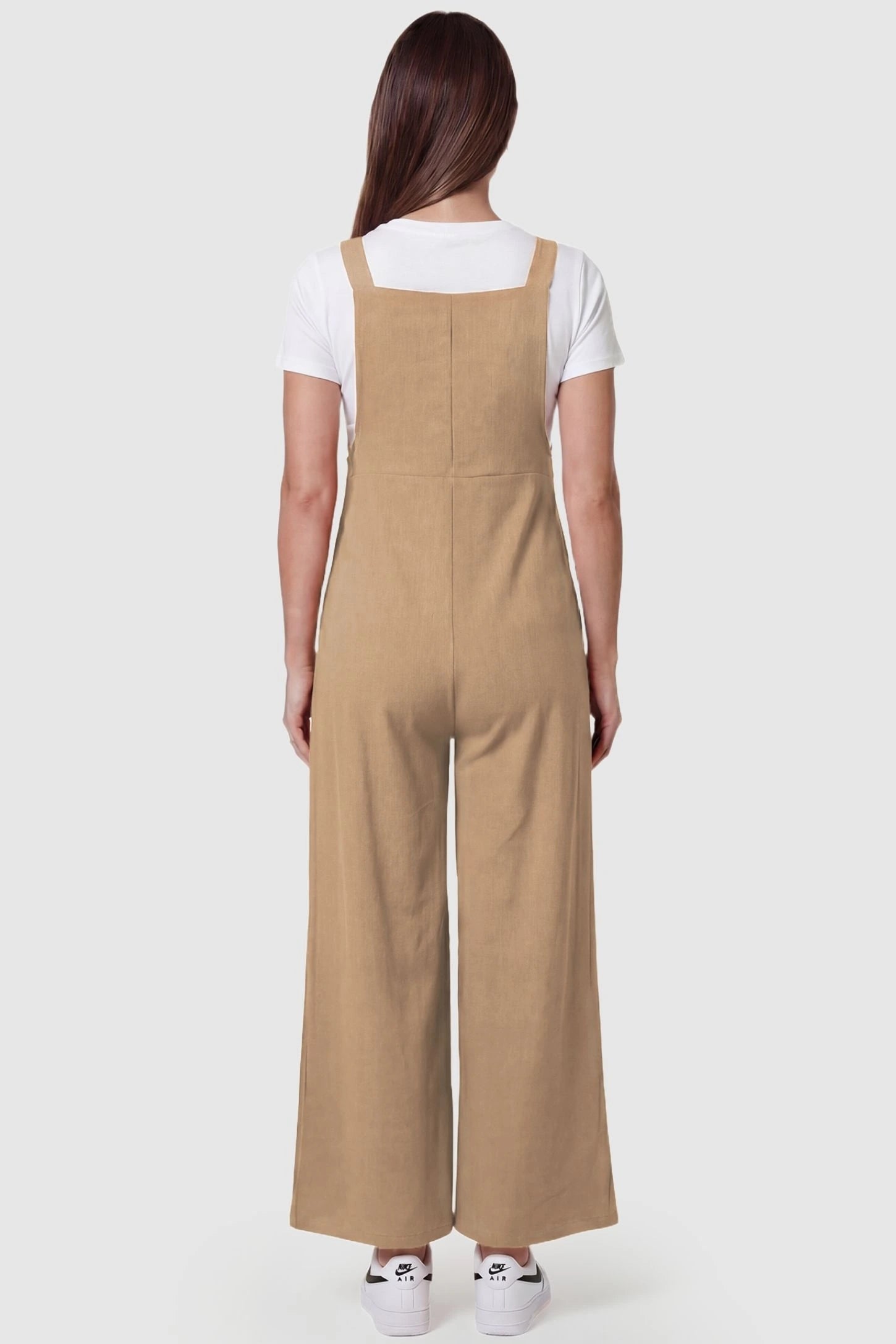 Full-Length Pocketed Maternity Jumpsuit Full-Length Pocketed Maternity Jumpsuit in Khaki featuring relaxed fit on a pregnant model, back view.