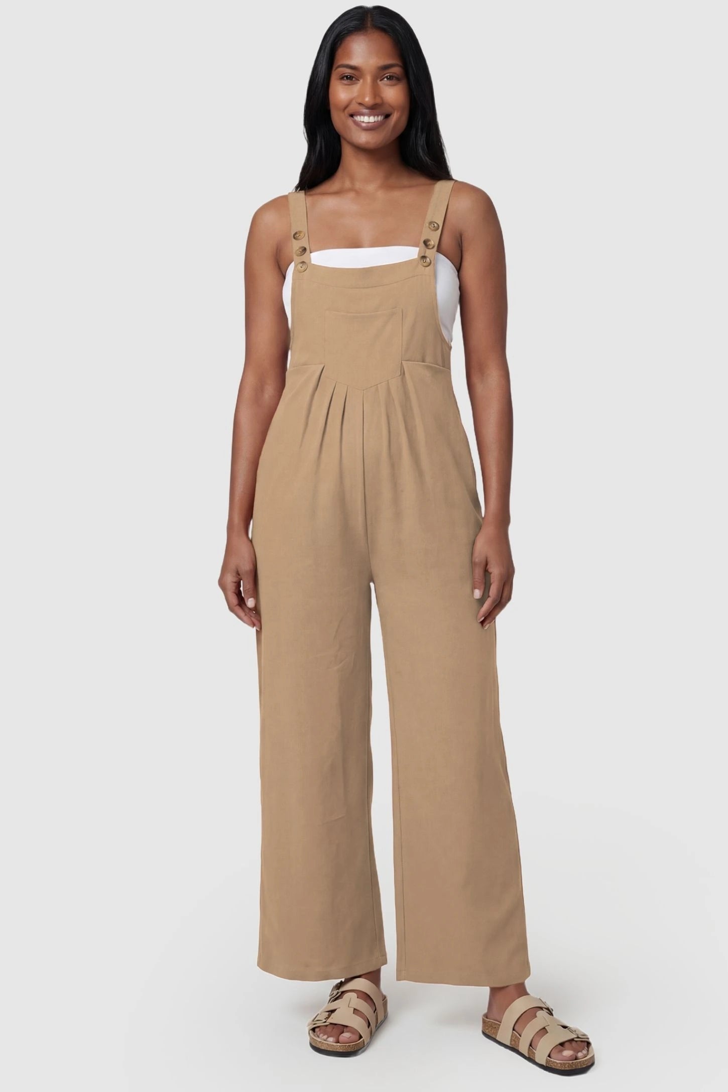 Full-Length Pocketed Maternity Jumpsuit Full-Length Pocketed Maternity Jumpsuit in Khaki featuring adjustable straps and a relaxed fit on a model, postpartum.