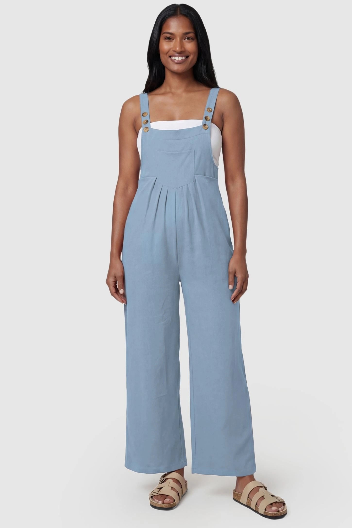 Full-Length Pocketed Maternity Jumpsuit Full-Length Pocketed Maternity Jumpsuit in Light Blue featuring adjustable straps and a relaxed fit on a model, postpartum.