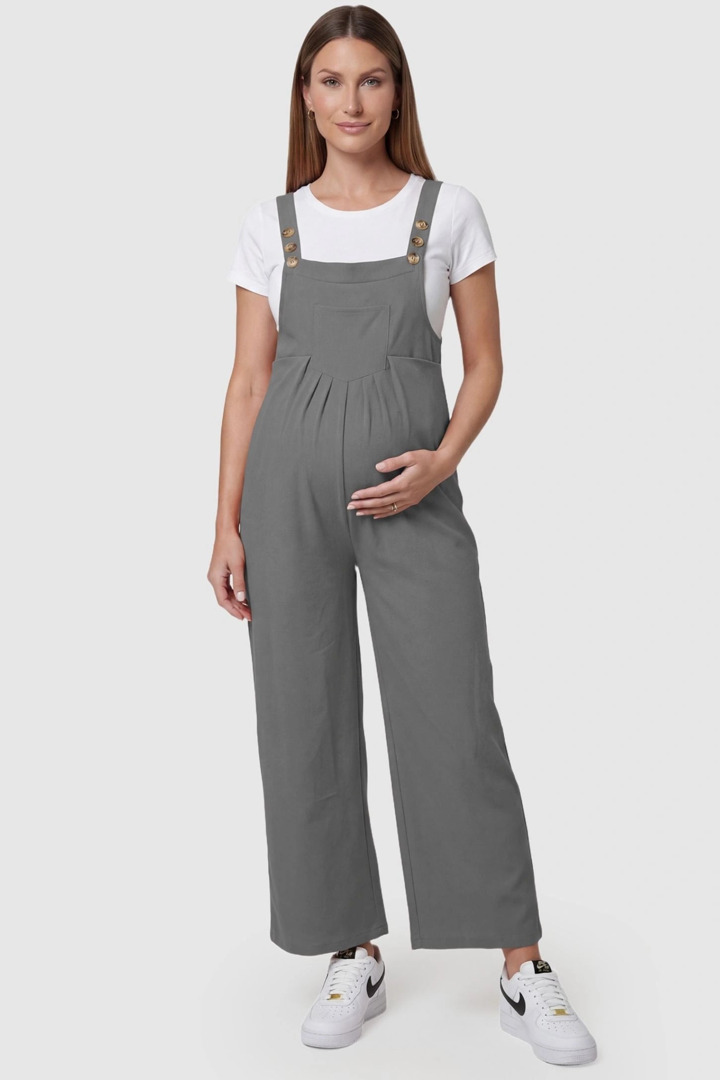 Full-Length Pocketed Maternity Jumpsuit Full-Length Pocketed Maternity Jumpsuit in Light Gray featuring adjustable straps and a relaxed fit on a pregnant model, front view.