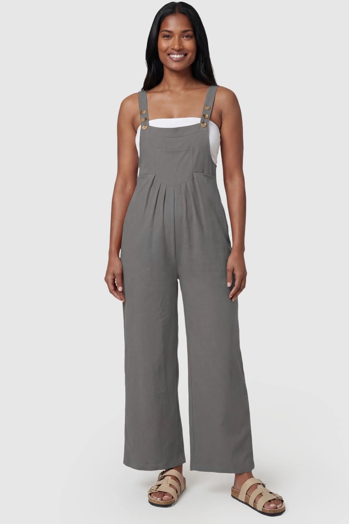 Full-Length Pocketed Maternity Jumpsuit Full-Length Pocketed Maternity Jumpsuit in Light Gray featuring adjustable straps and a relaxed fit on a model, postpartum.