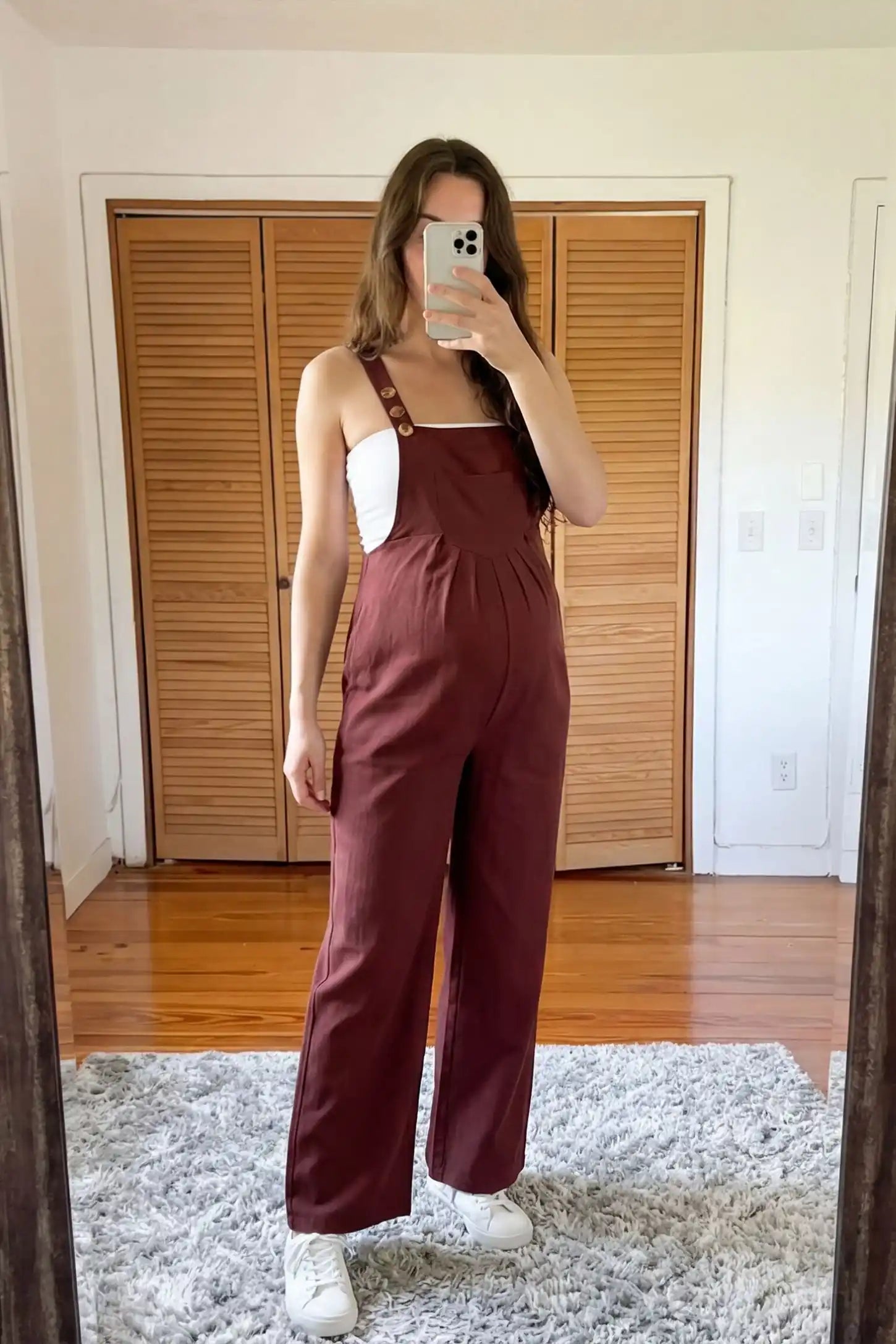 Full-Length Pocketed Maternity Jumpsuit Full-Length Pocketed Maternity Jumpsuit in Orange Red featuring adjustable straps and a relaxed fit on a pregnant model, front view.