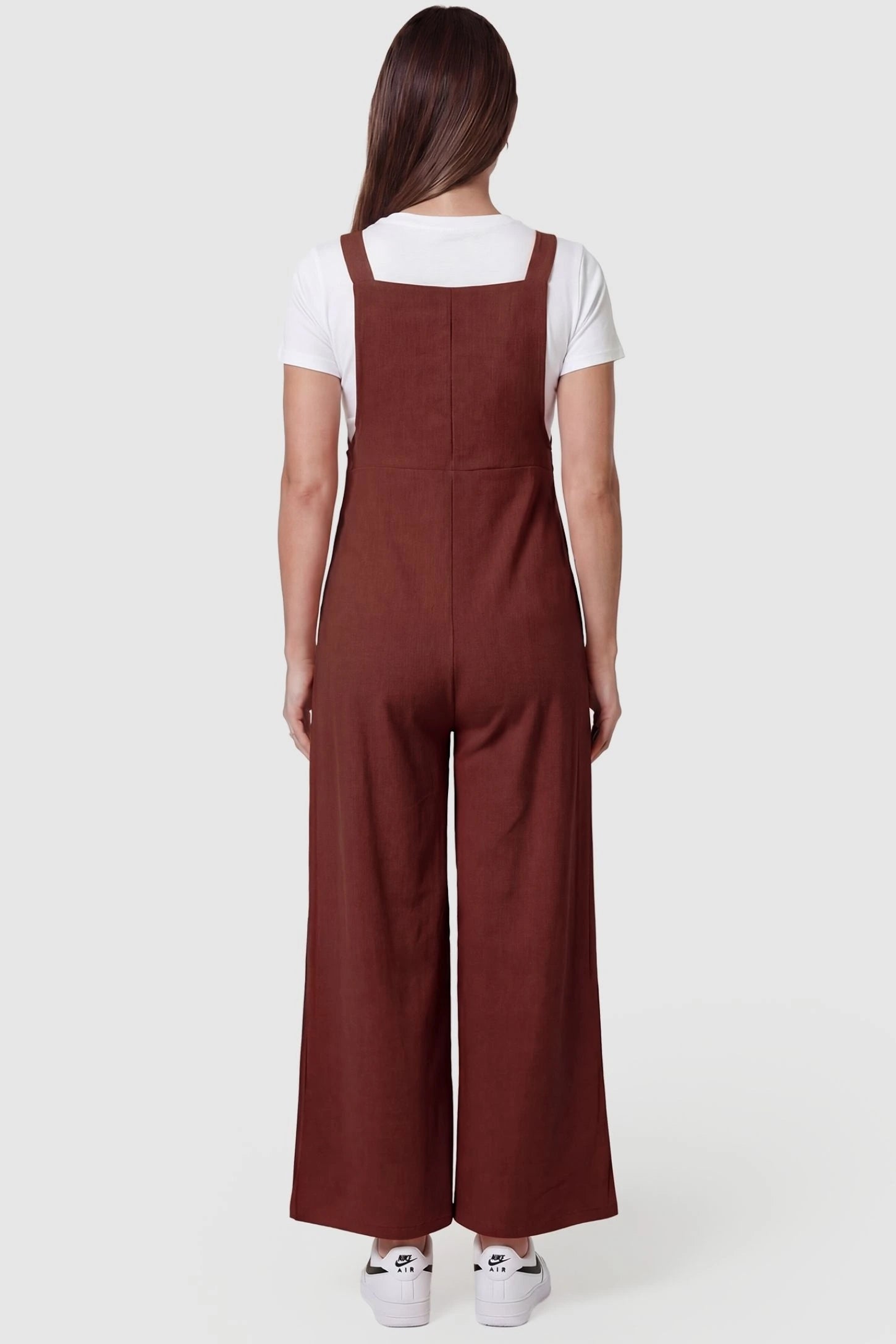 Full-Length Pocketed Maternity Jumpsuit Full-Length Pocketed Maternity Jumpsuit in Orange Red featuring relaxed fit on a pregnant model, back view.