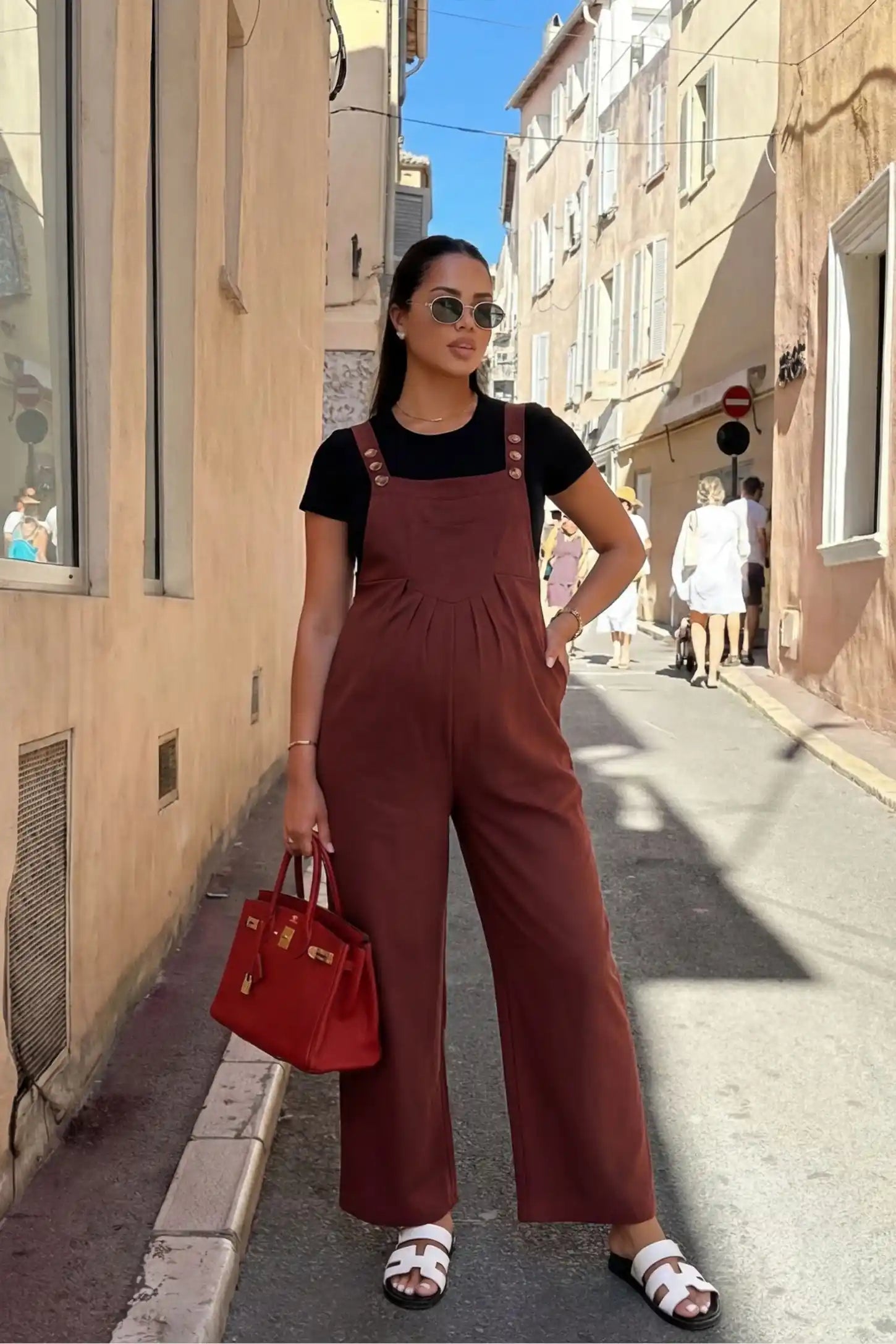 Full-Length Pocketed Maternity Jumpsuit Full-Length Pocketed Maternity Jumpsuit in Orange Red featuring adjustable straps and a relaxed fit on a pregnant model, front view.