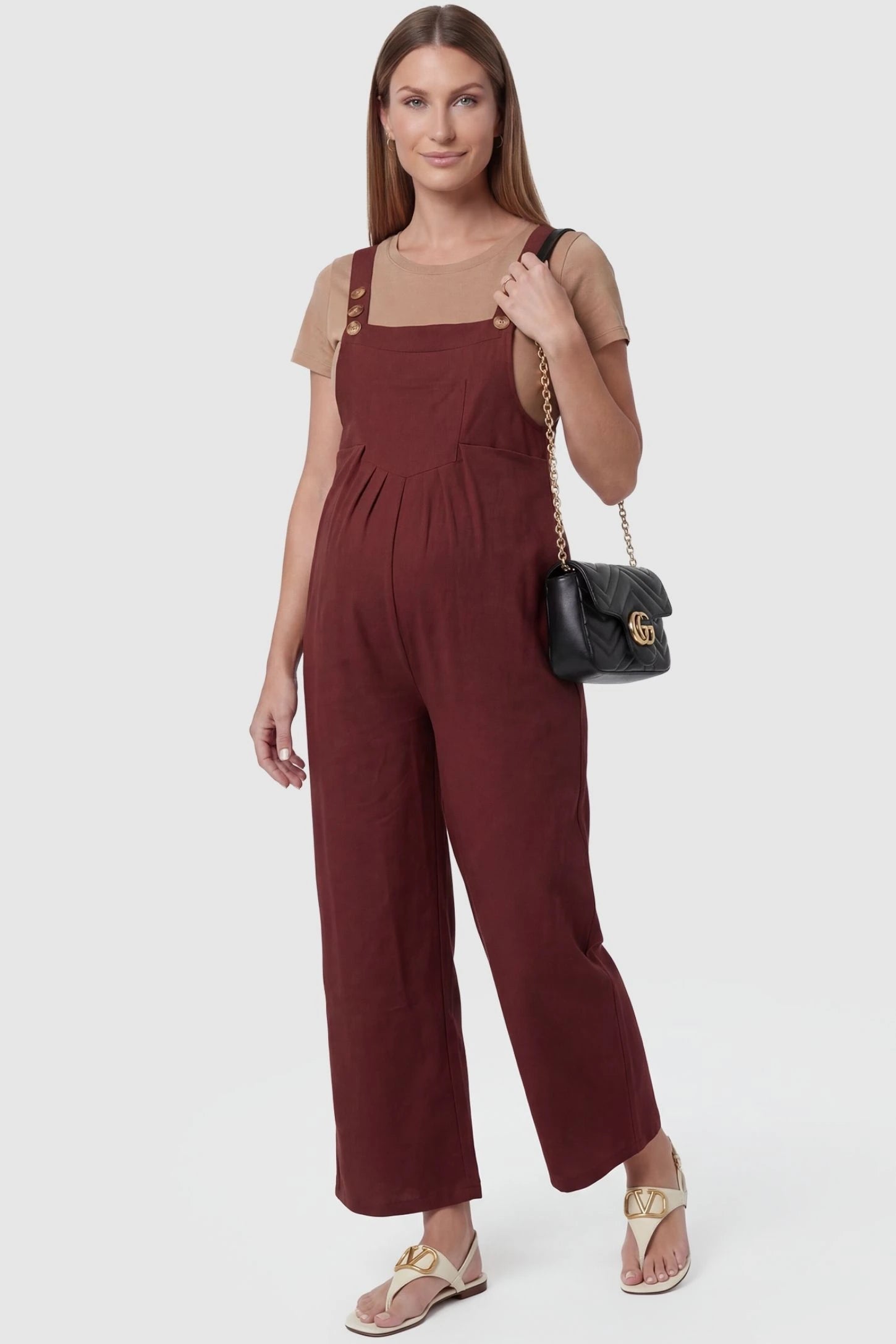 Full-Length Pocketed Maternity Jumpsuit Full-Length Pocketed Maternity Jumpsuit in Orange Red featuring adjustable straps and a relaxed fit on a pregnant model, front view.