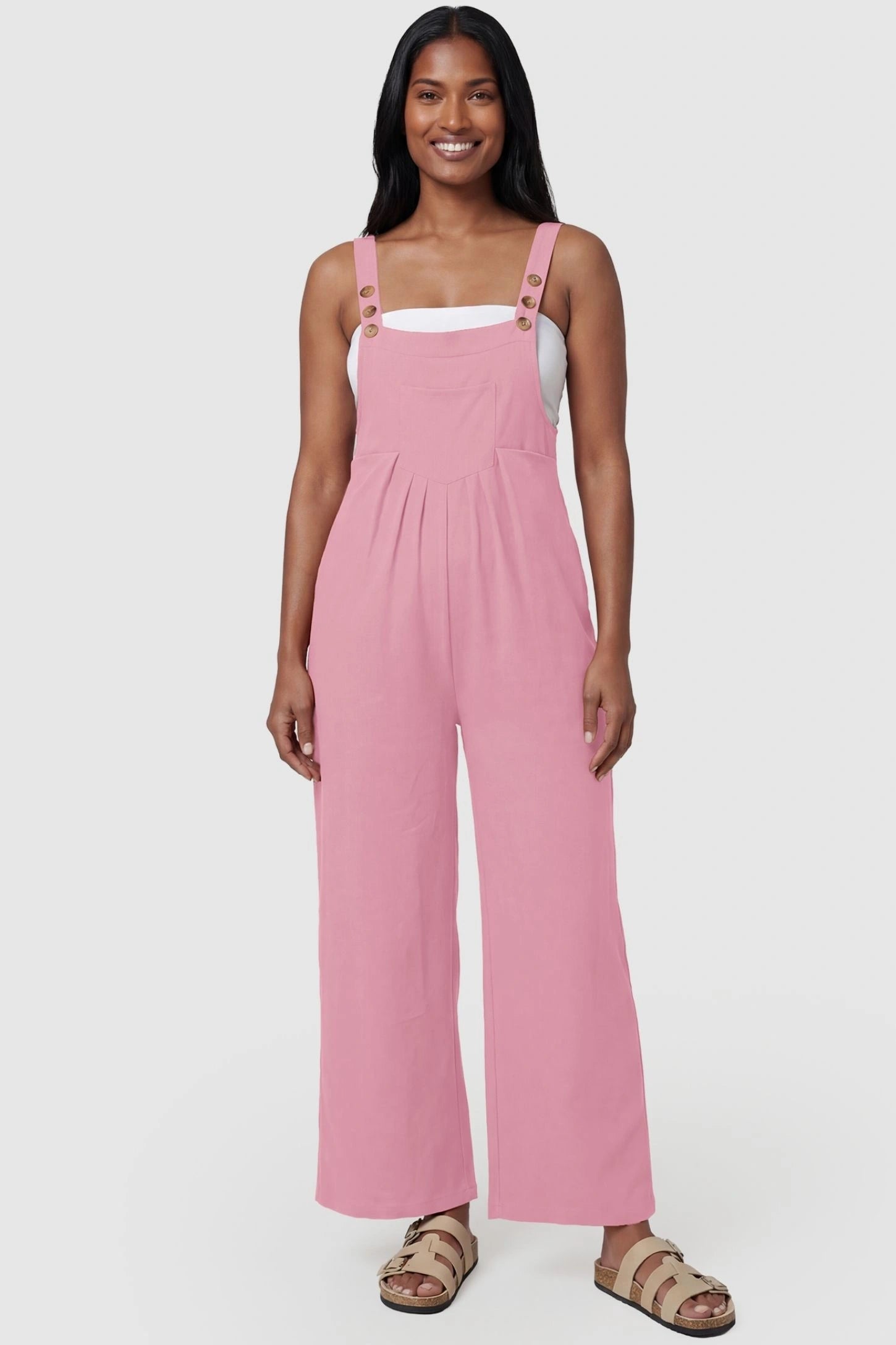 Full-Length Pocketed Maternity Jumpsuit Full-Length Pocketed Maternity Jumpsuit in Pink featuring adjustable straps and a relaxed fit on a model, postpartum.