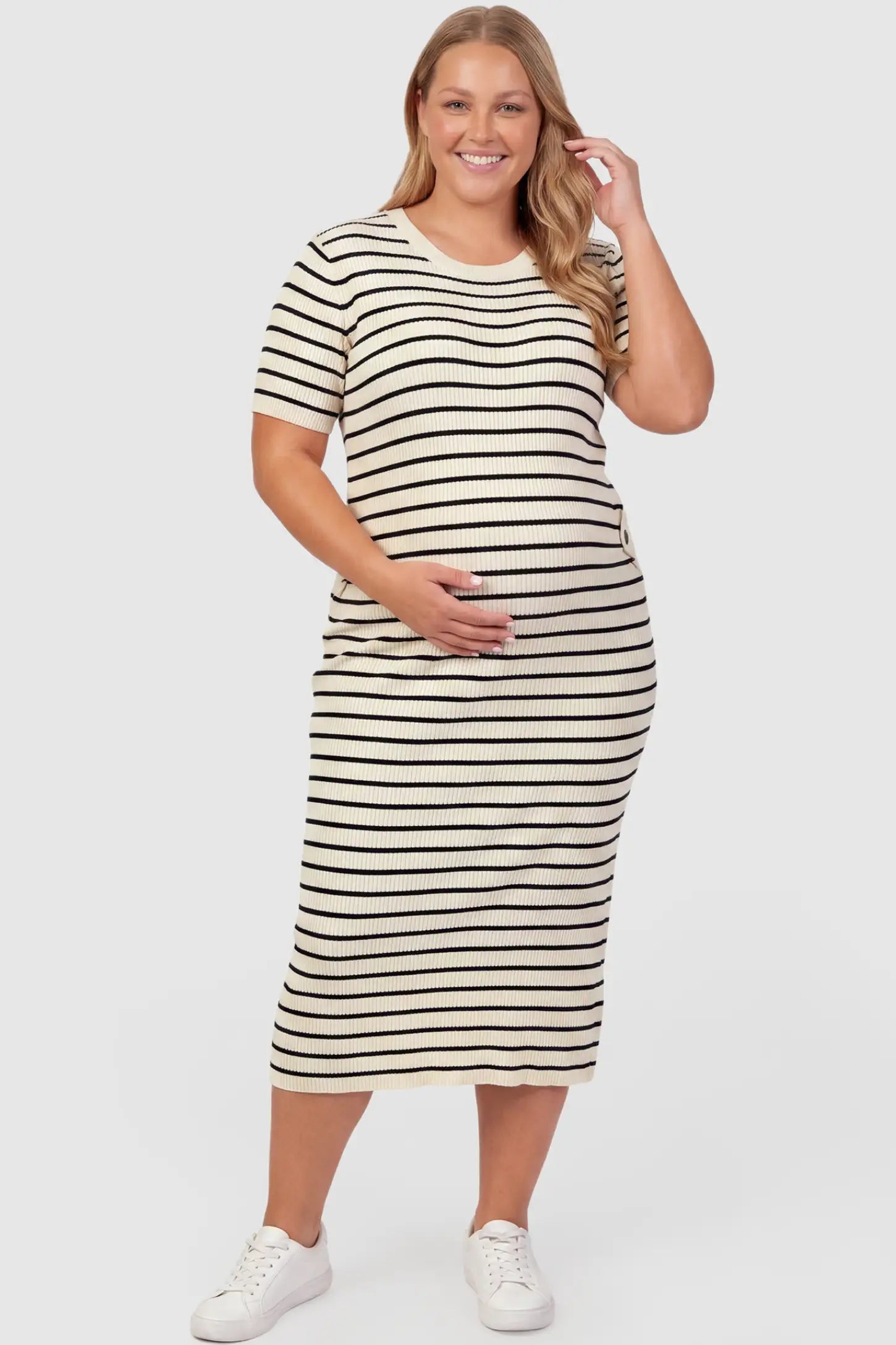 Soft Knit Short Sleeve Bodycon Maternity Midi Dress Soft Knit Short Sleeve Bodycon Maternity Midi Dress in beige stripes with classic stripes, front view on plus-size model