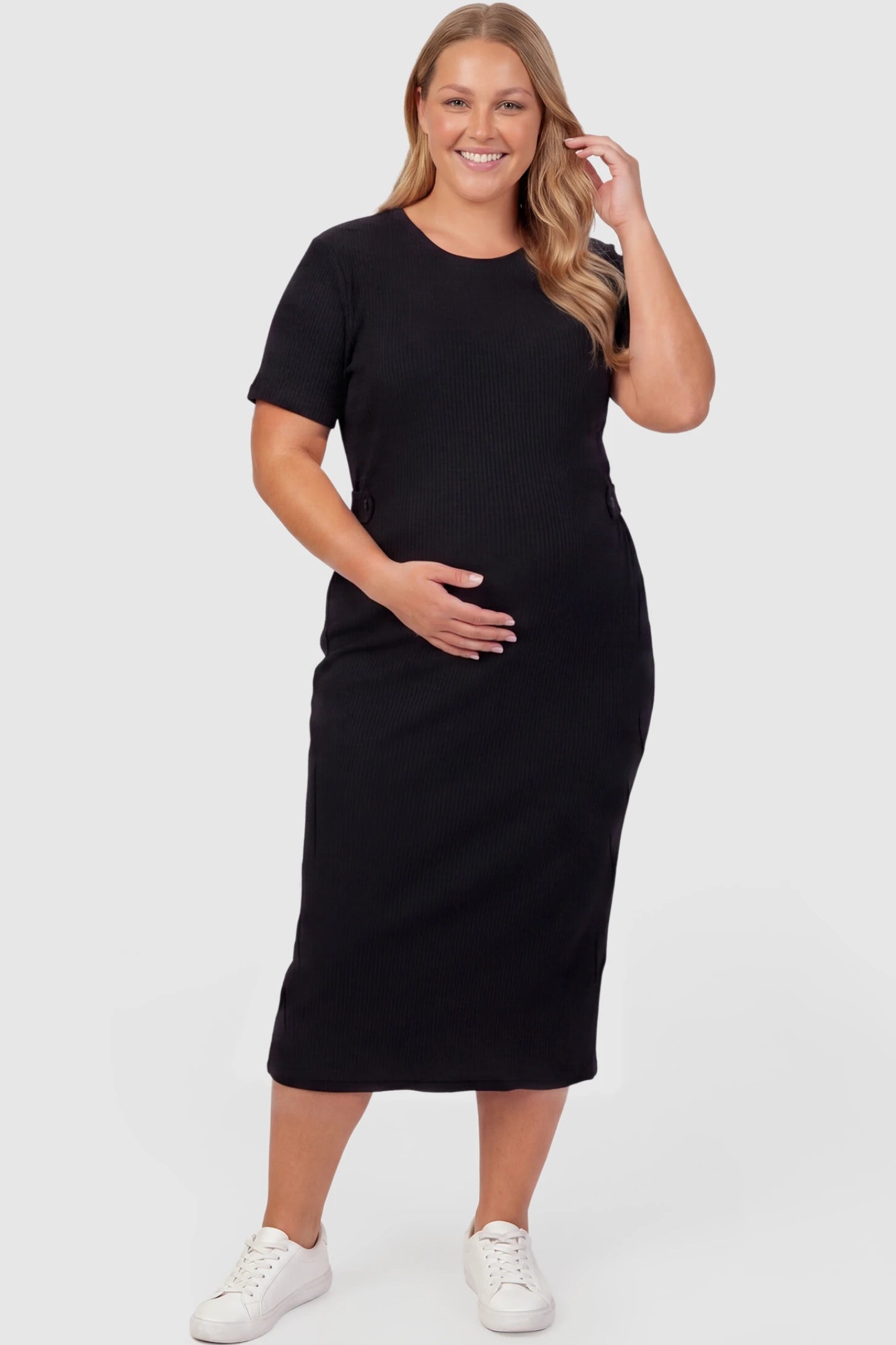 Soft Knit Short Sleeve Bodycon Maternity Midi Dress Soft Knit Short Sleeve Bodycon Maternity Midi Dress in black with round neck & short sleeves, front view on plus-size model