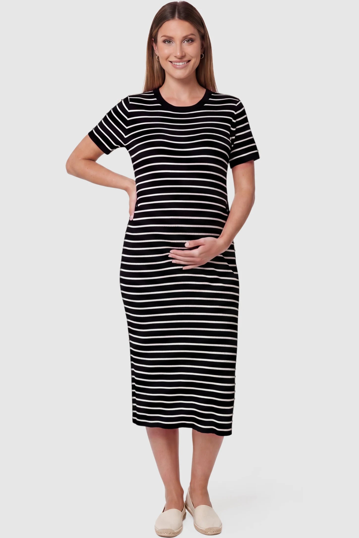 Soft Knit Short Sleeve Bodycon Maternity Midi Dress in black stripes with classic stripes, front view on pregnant model