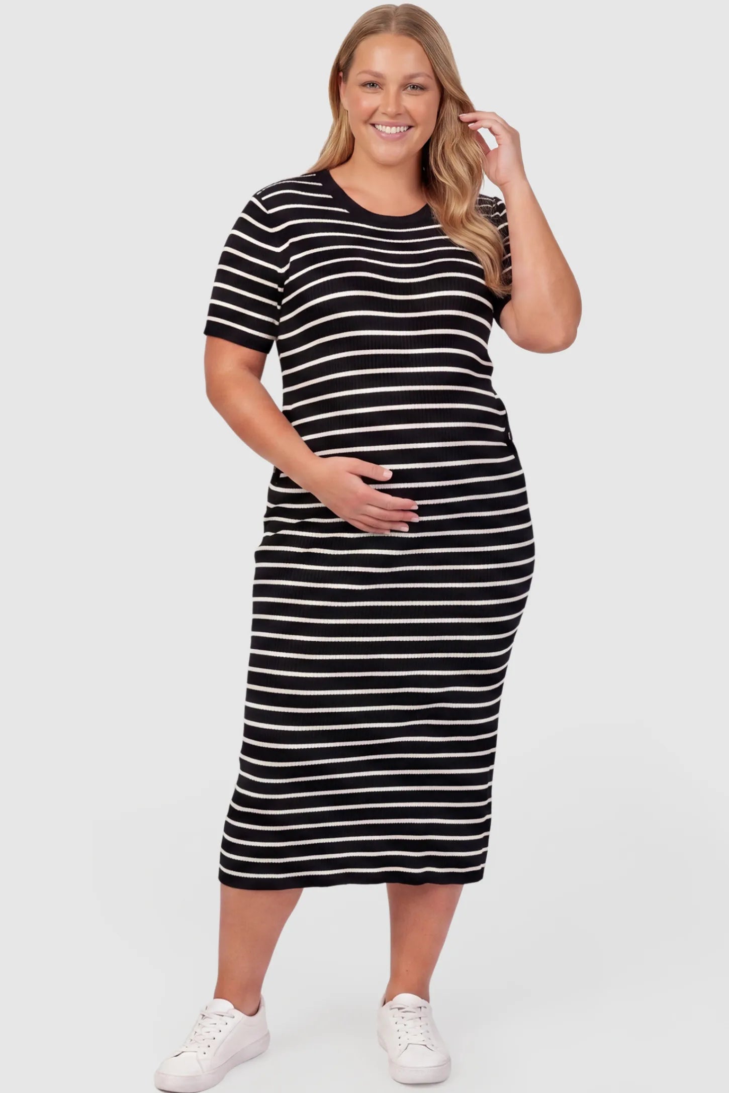 Soft Knit Short Sleeve Bodycon Maternity Midi Dress Soft Knit Short Sleeve Bodycon Maternity Midi Dress in black stripes with classic stripes, front view on plus-size model
