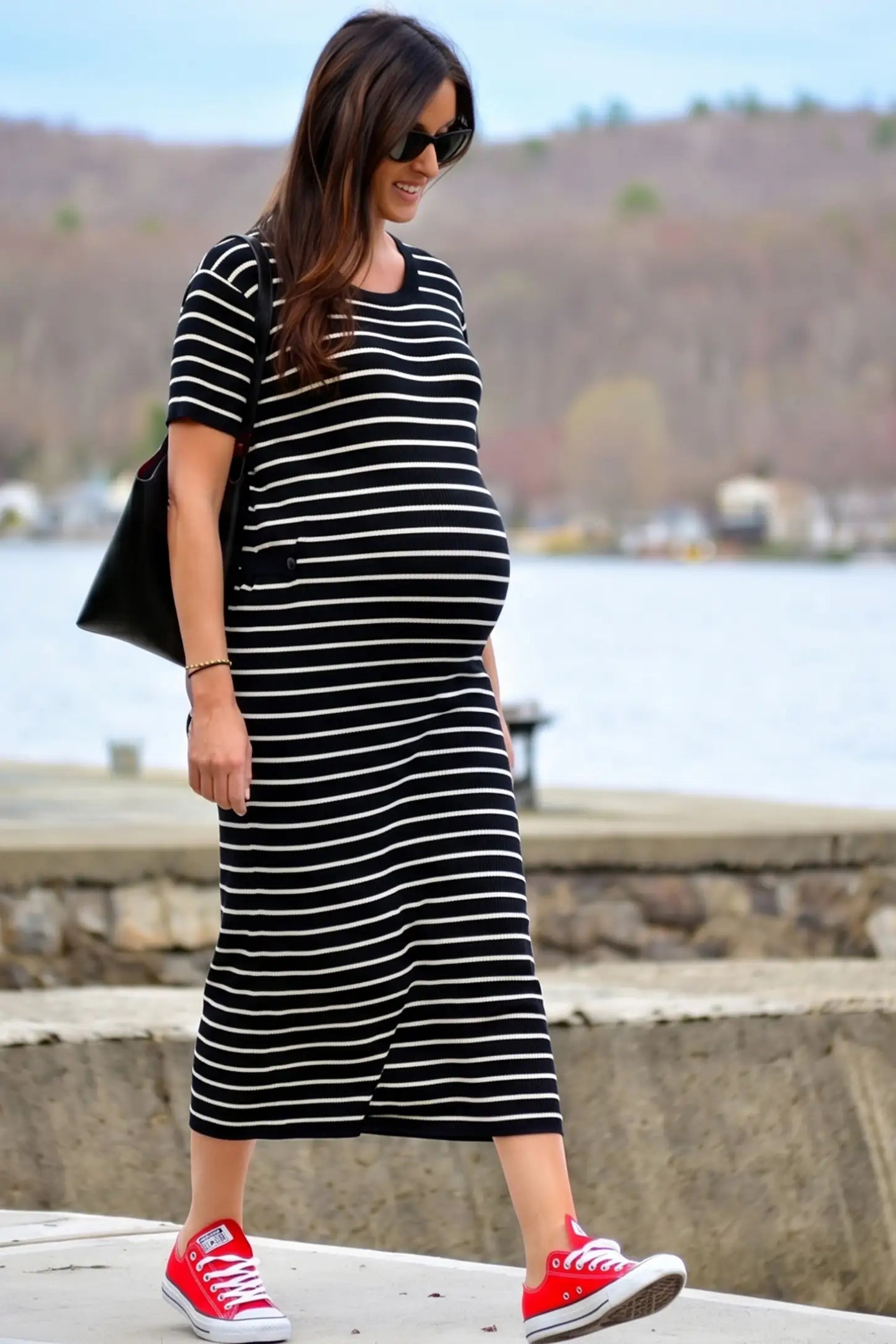Soft Knit Short Sleeve Bodycon Maternity Midi Dress Soft Knit Short Sleeve Bodycon Maternity Midi Dress in black stripes with classic stripes, side view on pregnant model