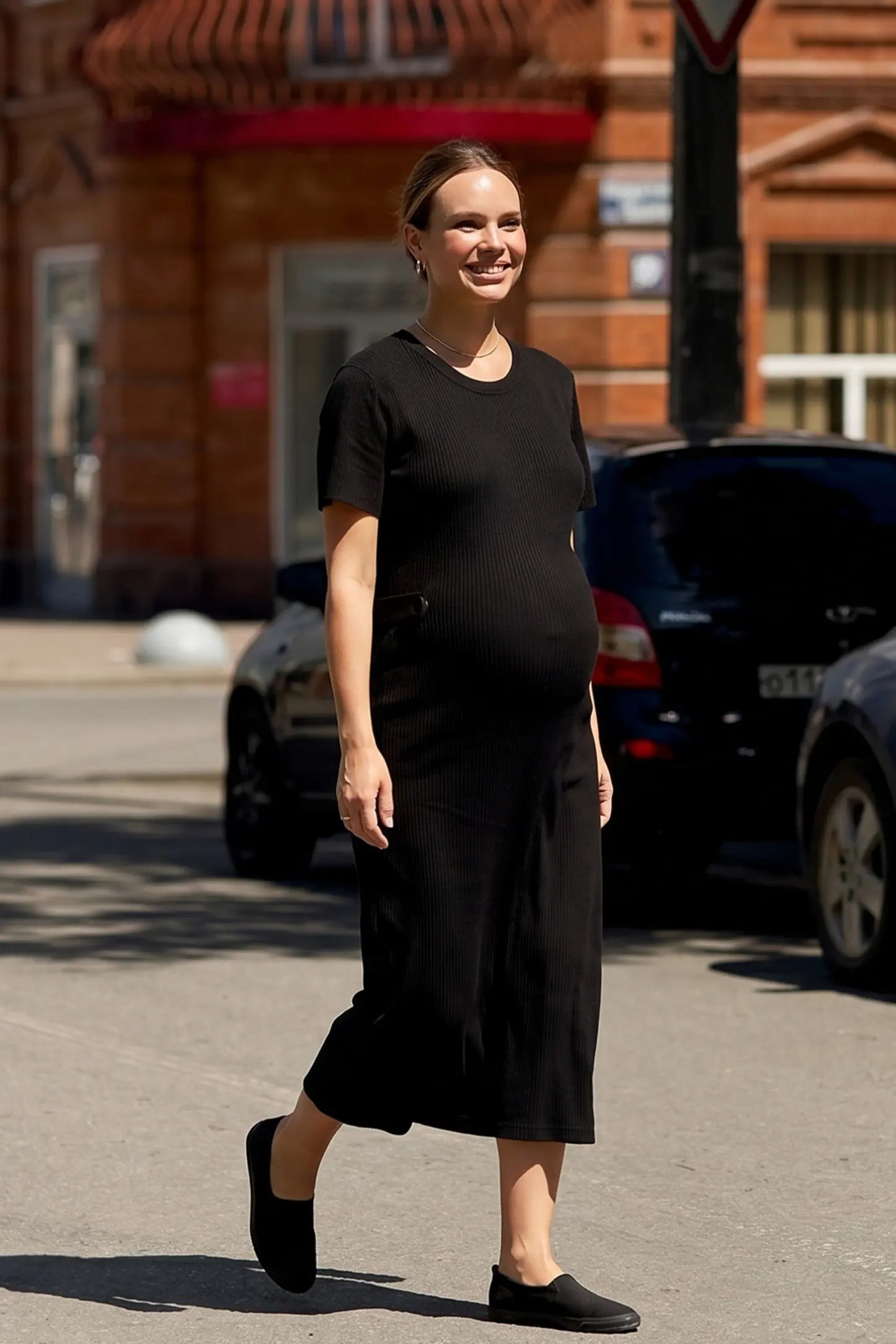 Soft Knit Short Sleeve Bodycon Maternity Midi Dress Soft Knit Short Sleeve Bodycon Maternity Midi Dress in black with round neck & short sleeves, front view on pregnant model