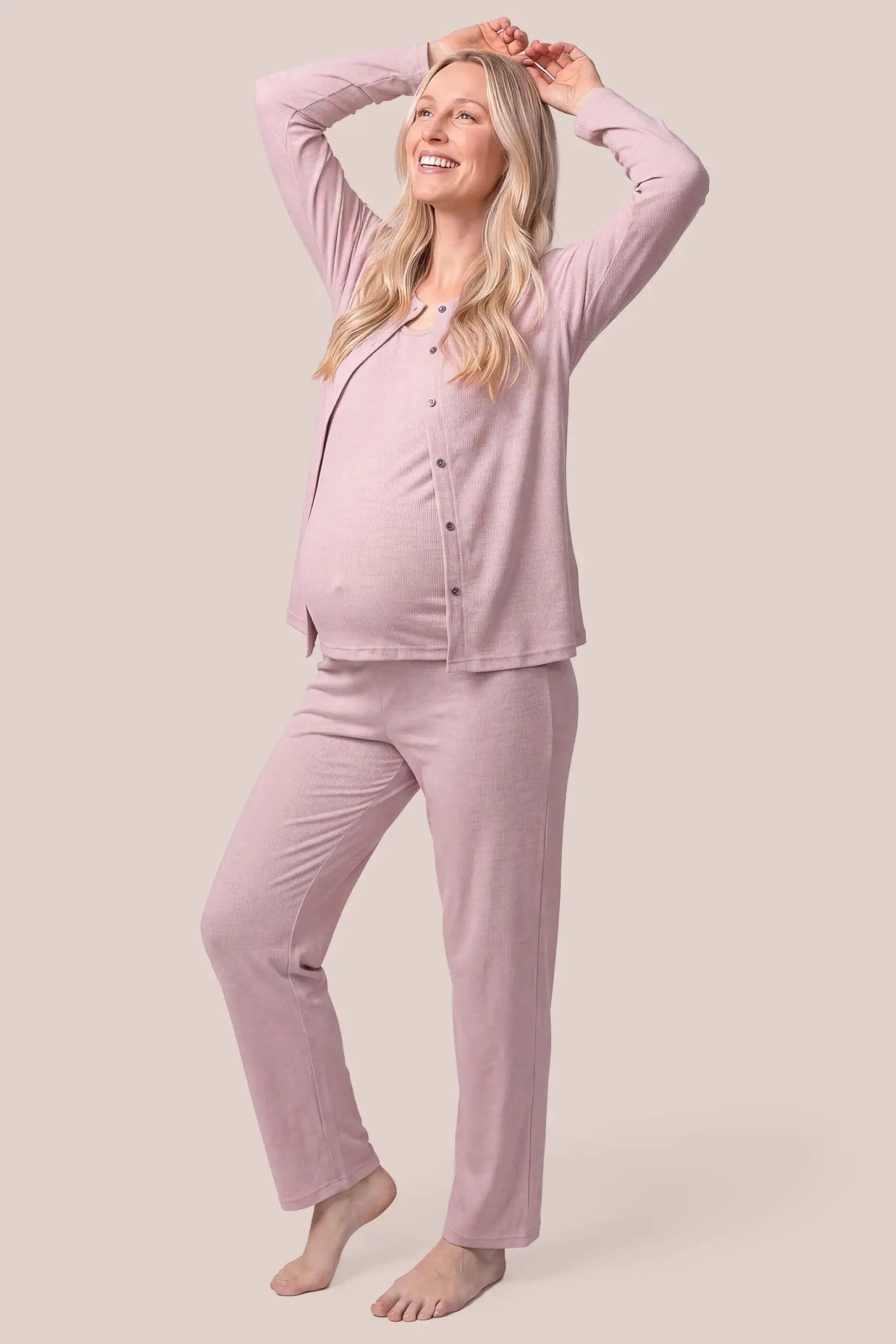 Soft Rib Knit Maternity & Nursing Pajama Set with Cami, Cardigan & Pants in Soft Pink featuring comfortable bump-friendly drape, adjustable waistband support, and open cardigan style on a pregnant model, side view.