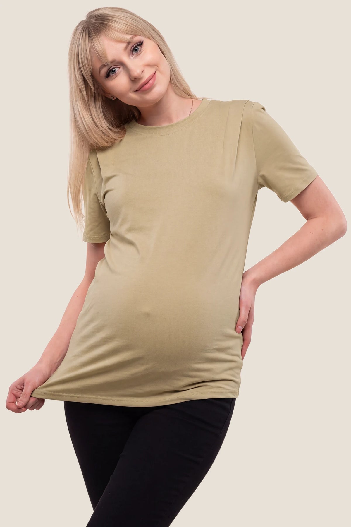 Solid Round Neck Short Sleeve Maternity Top Solid Round Neck Short Sleeve Maternity Top in Brown featuring a round neckline, soft-touch fabric, short sleeves, and a comfortable maternity fit on a pregnant model, front view.
