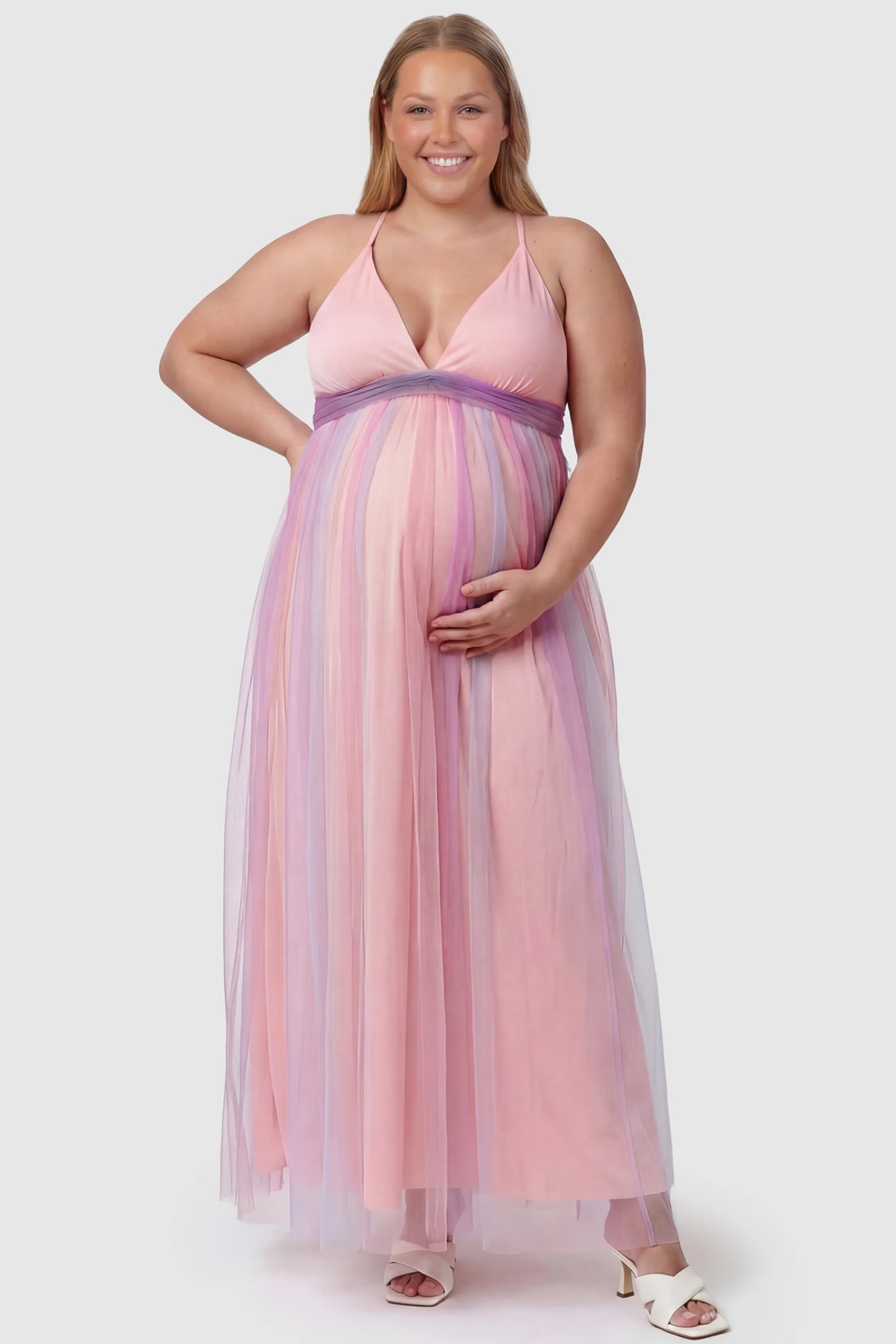 Rainbow Gradient Deep V-Neck Maternity Dress Rainbow Gradient Deep V-Neck Maternity Dress in gradient tulle featuring crossover bodice and empire waist on a plus size pregnant model.