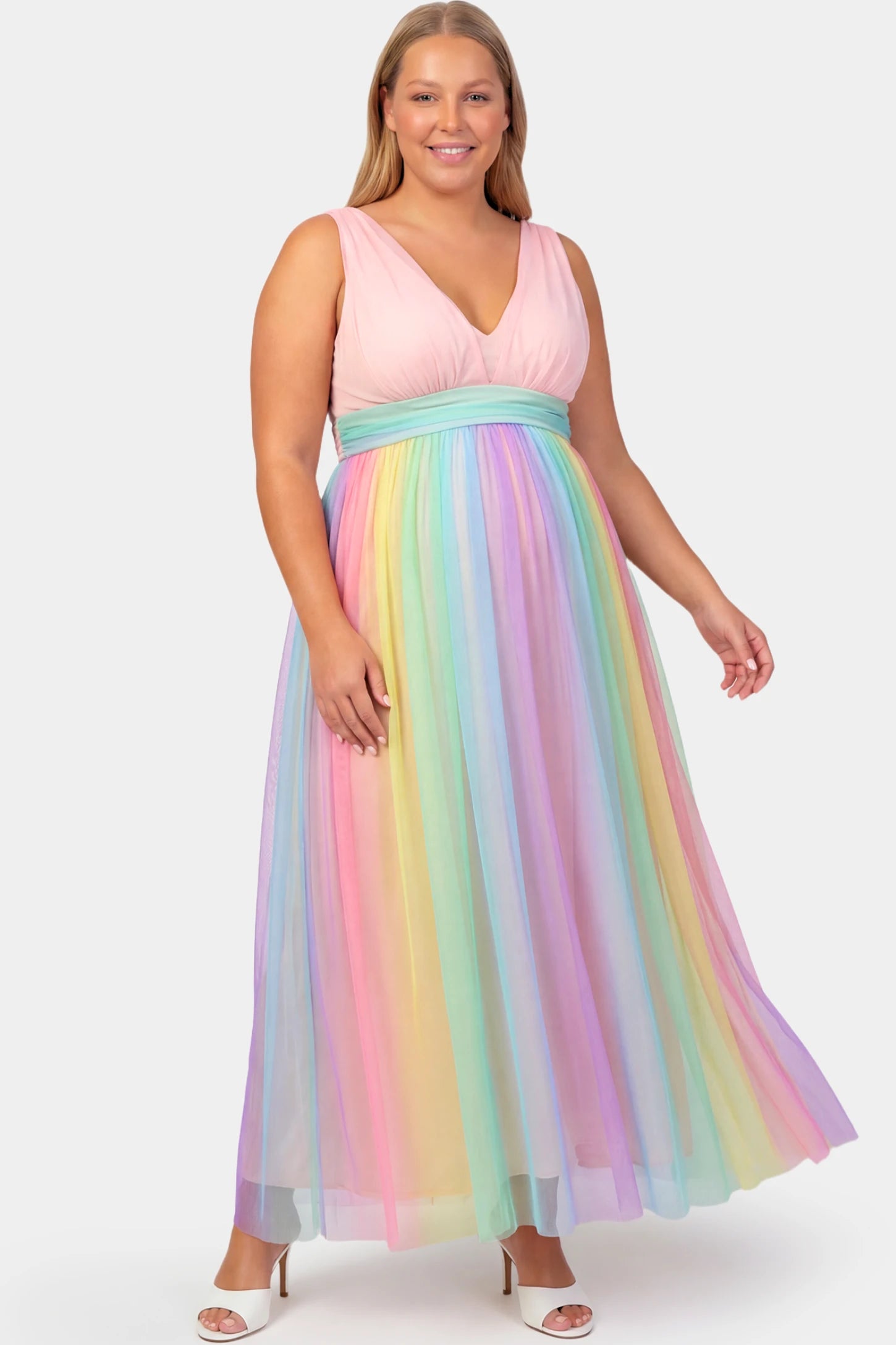 Rainbow Gradient Deep V-Neck Maternity Gown Rainbow Gradient Deep V-Neck Maternity Gown in gradient tulle featuring crossover bodice and empire waist on a plus size pregnant model.