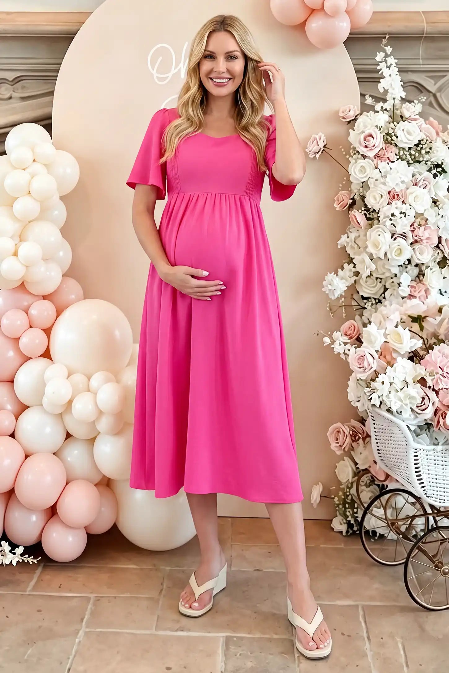 Square Neck Flutter Sleeve A-Line Maternity Midi Dress in rose red featuring flowing silhouette in full body view on a editorial lifestyle model