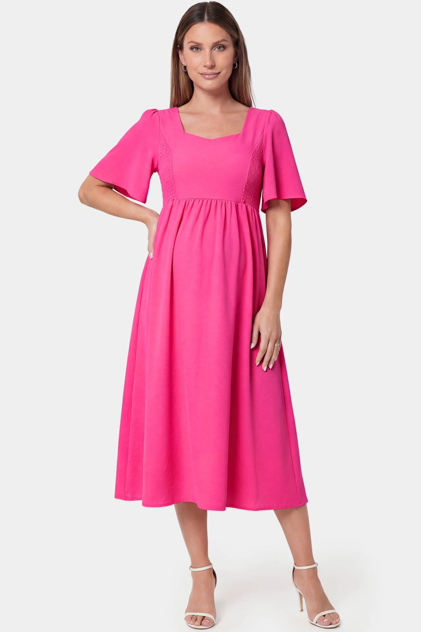 Square neck short sleeve large swing midi maternity dress in rose red featuring refined square neckline in front view on a pregnant model