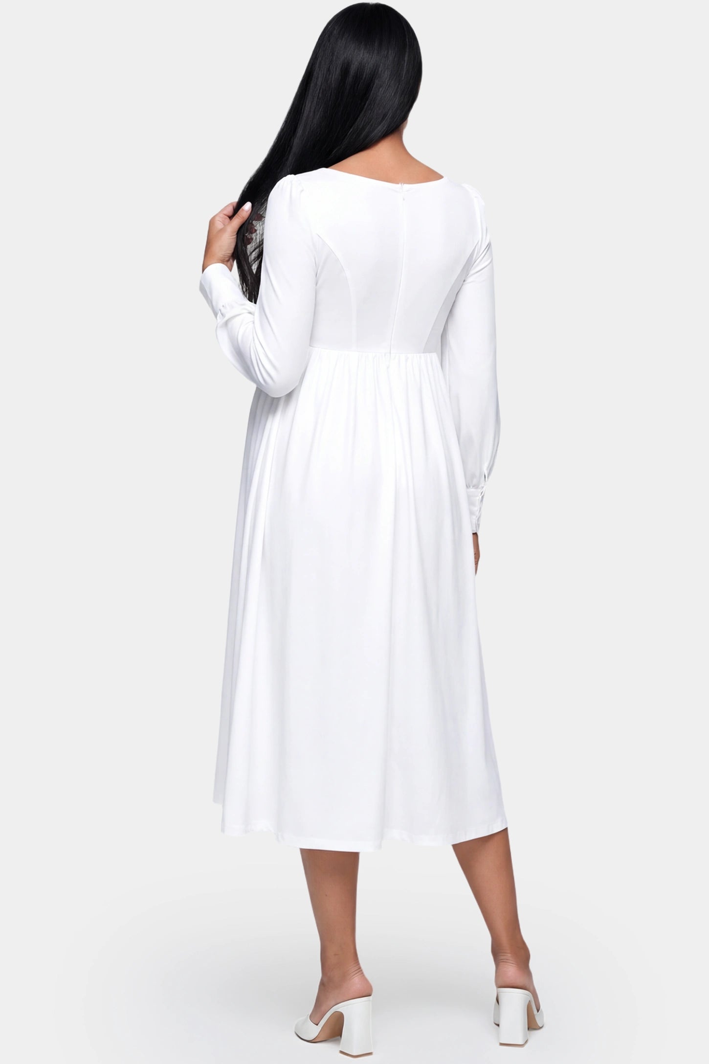 Square Neck Long Sleeve A-line Midi Maternity Dress Square neck long sleeve A-line midi maternity dress in white featuring long sleeves and A-line drape in back view on a pregnant model