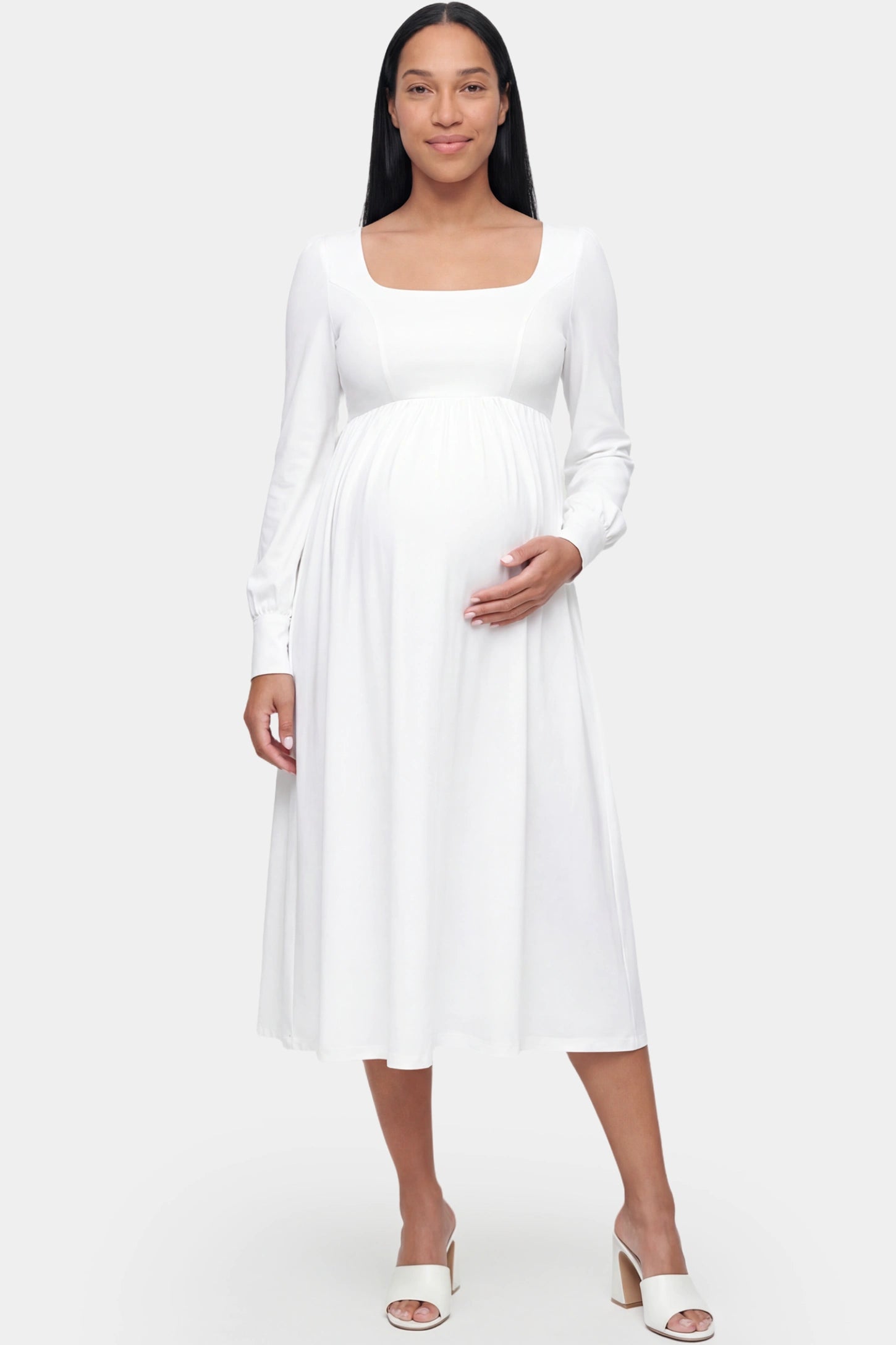Square neck long sleeve A-line midi maternity dress in white featuring refined square neckline in front view on a pregnant model
