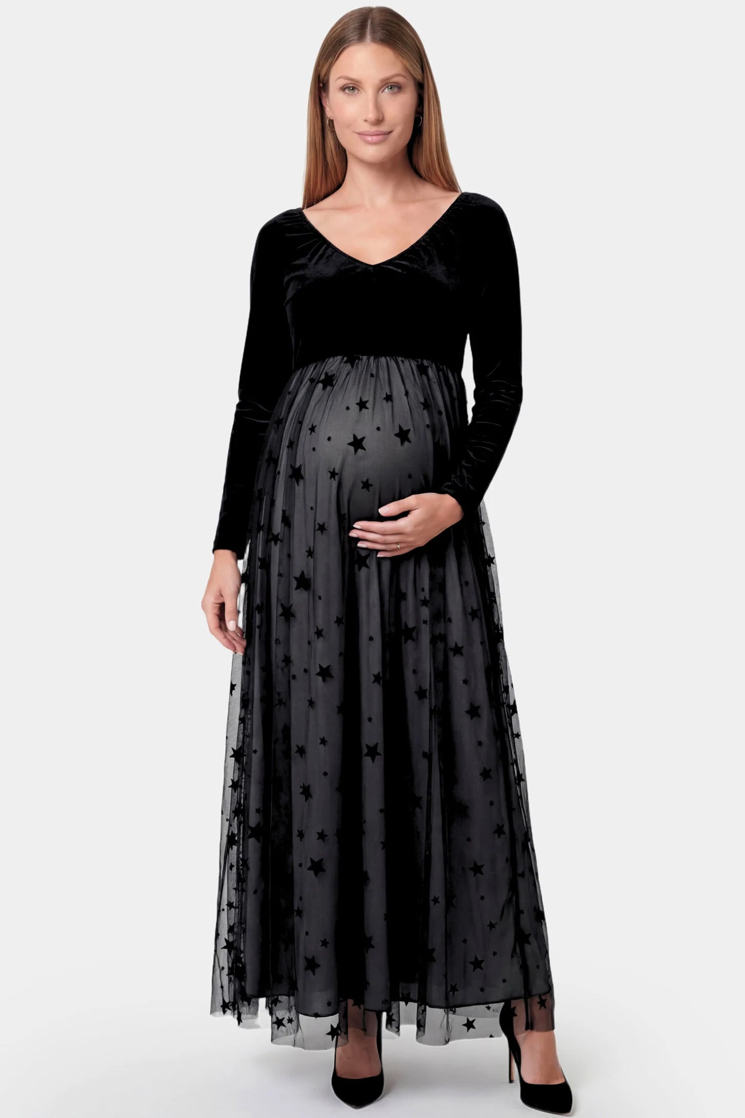 Stars Tulle Long Sleeve Maternity Gown in black featuring velvet bodice and A-line tulle skirt on a pregnant model.
