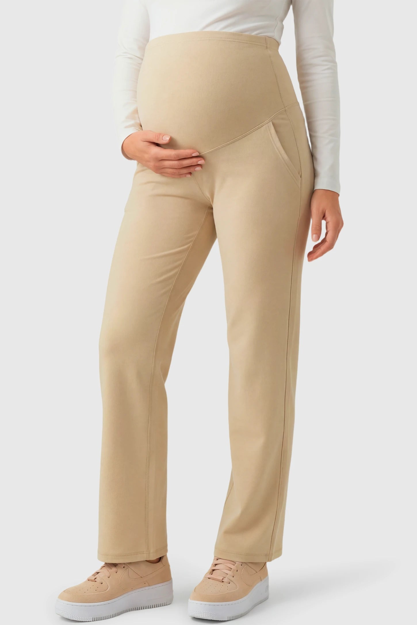 High-Waisted Straight-Leg Maternity Pants High Waisted Straight-Leg Maternity Pants in beige featuring over-the-belly support and standard length fit on pregnant model.