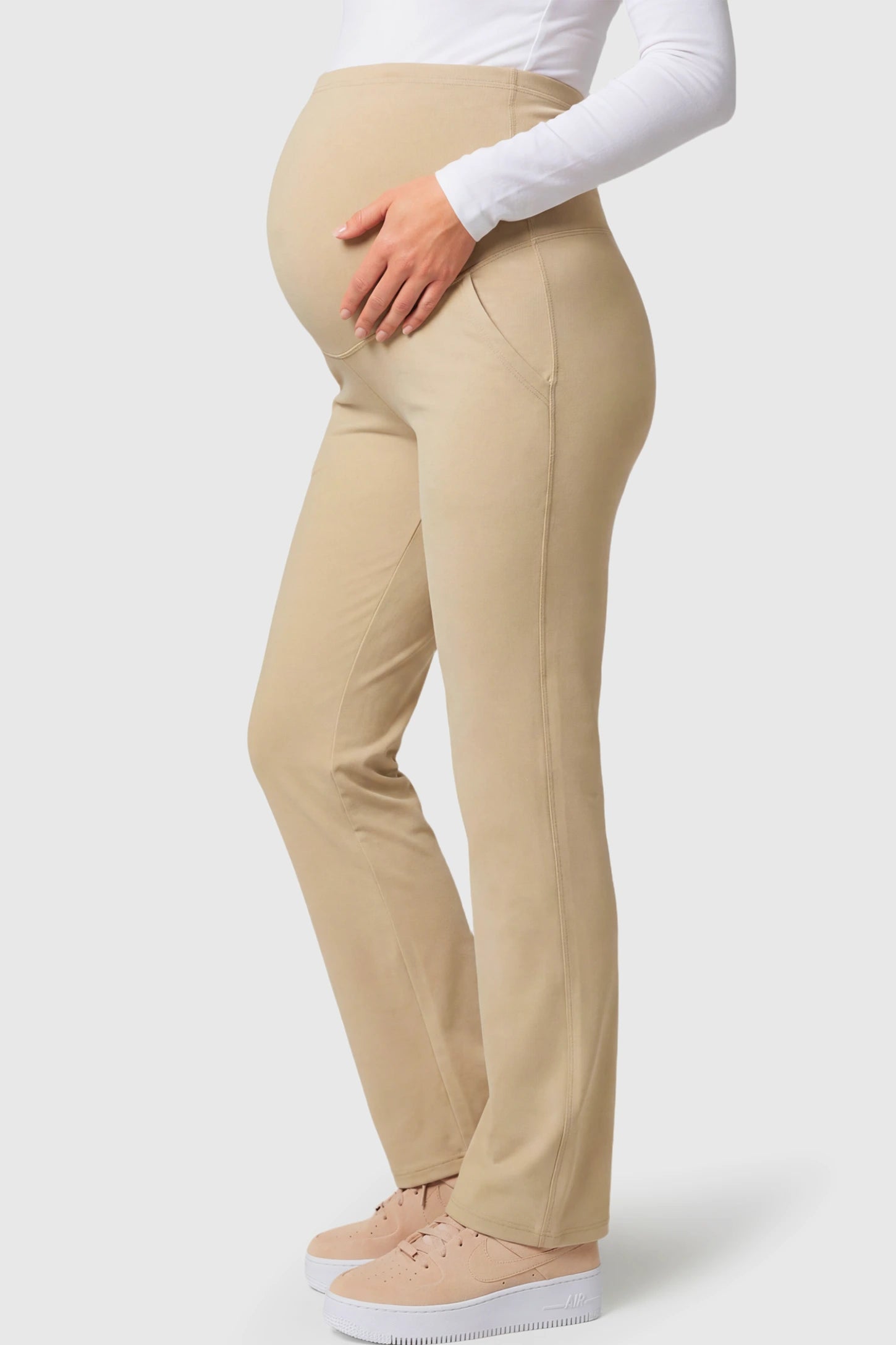 High-Waisted Straight-Leg Maternity Pants High Waisted Straight-Leg Maternity Pants in beige featuring over-the-belly support and standard length fit on pregnant model.